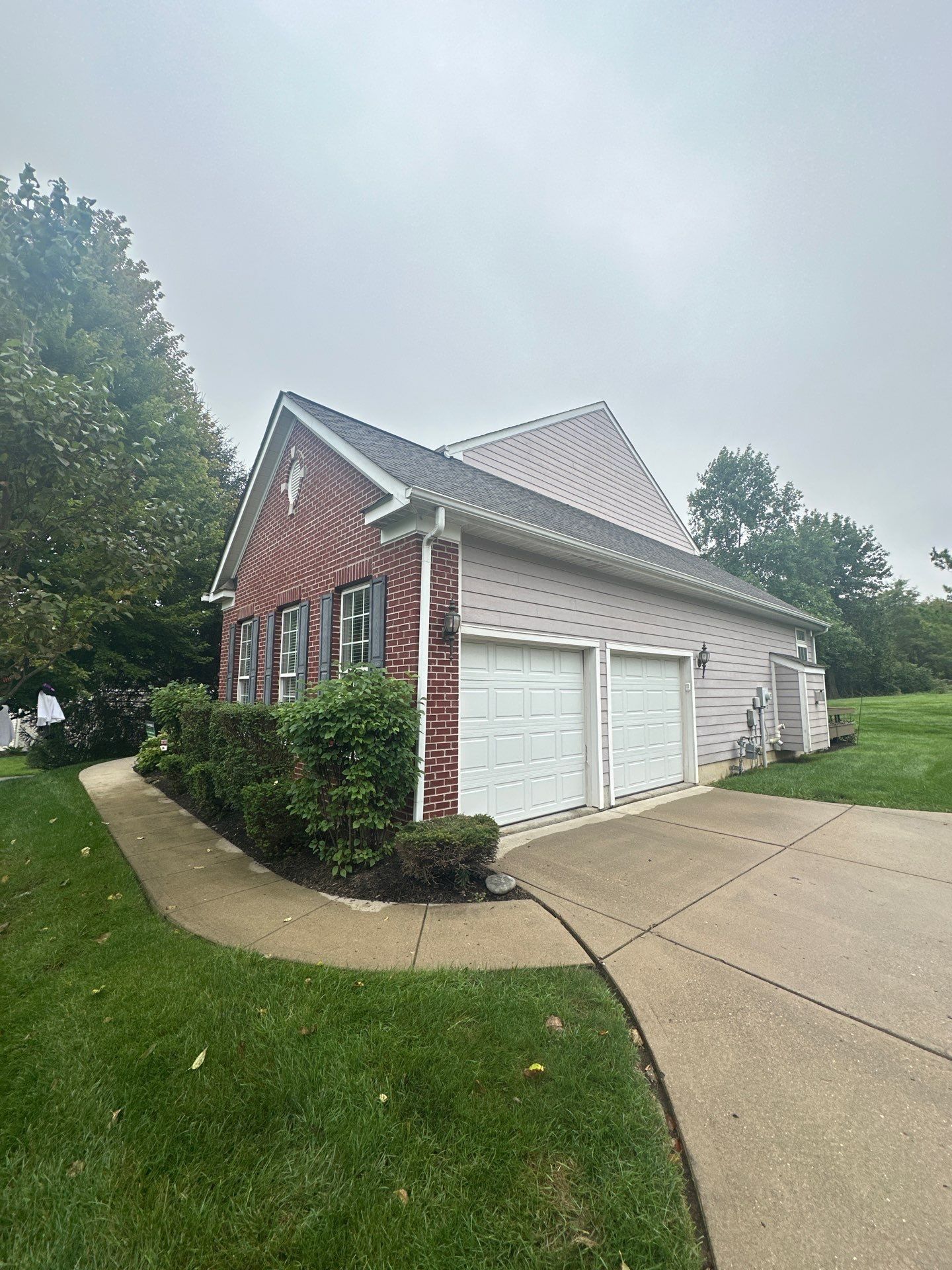 The side-entry garage and the side of the house from the front walk, Beavercreek, Ohio.