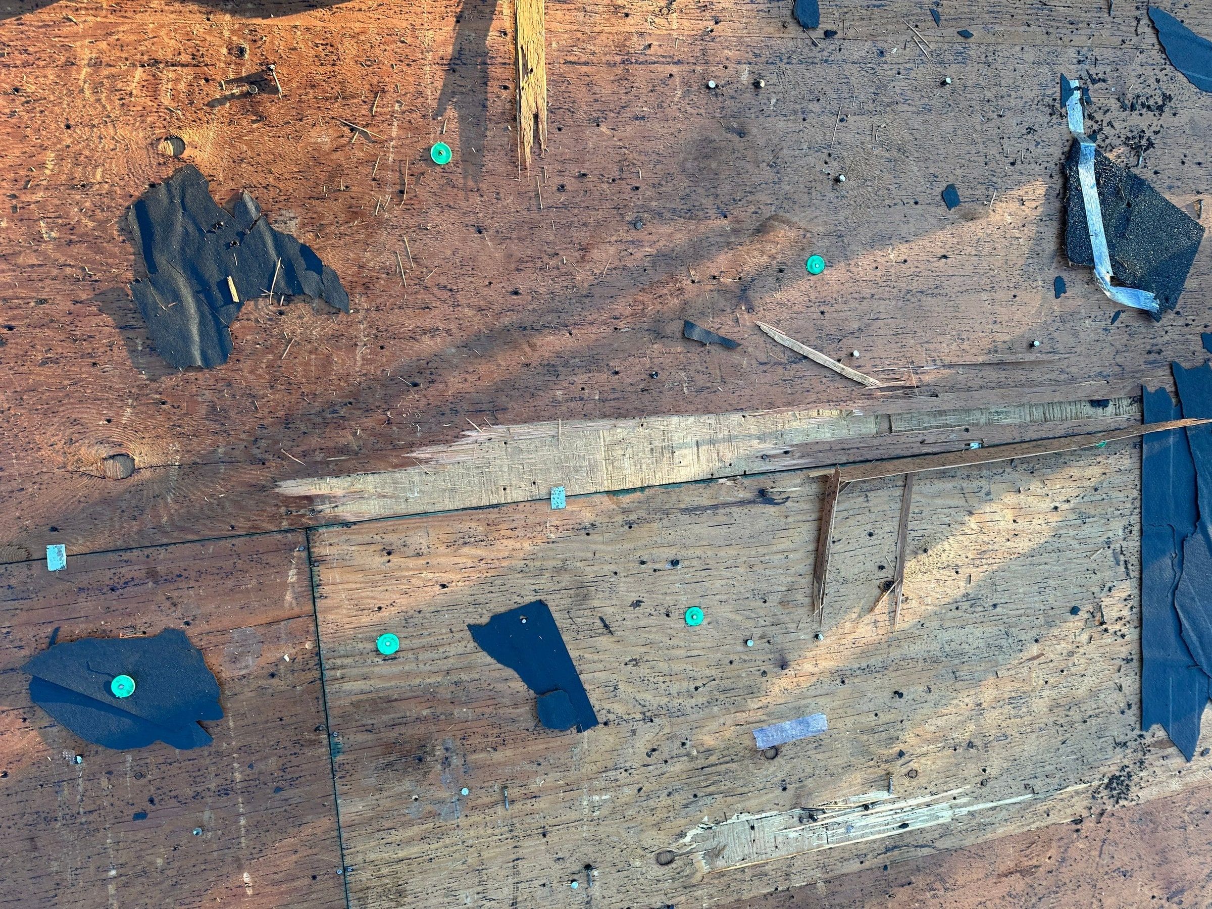 The bare deck after tear-off, with split and patched old boards, West Carrollton, Ohio.