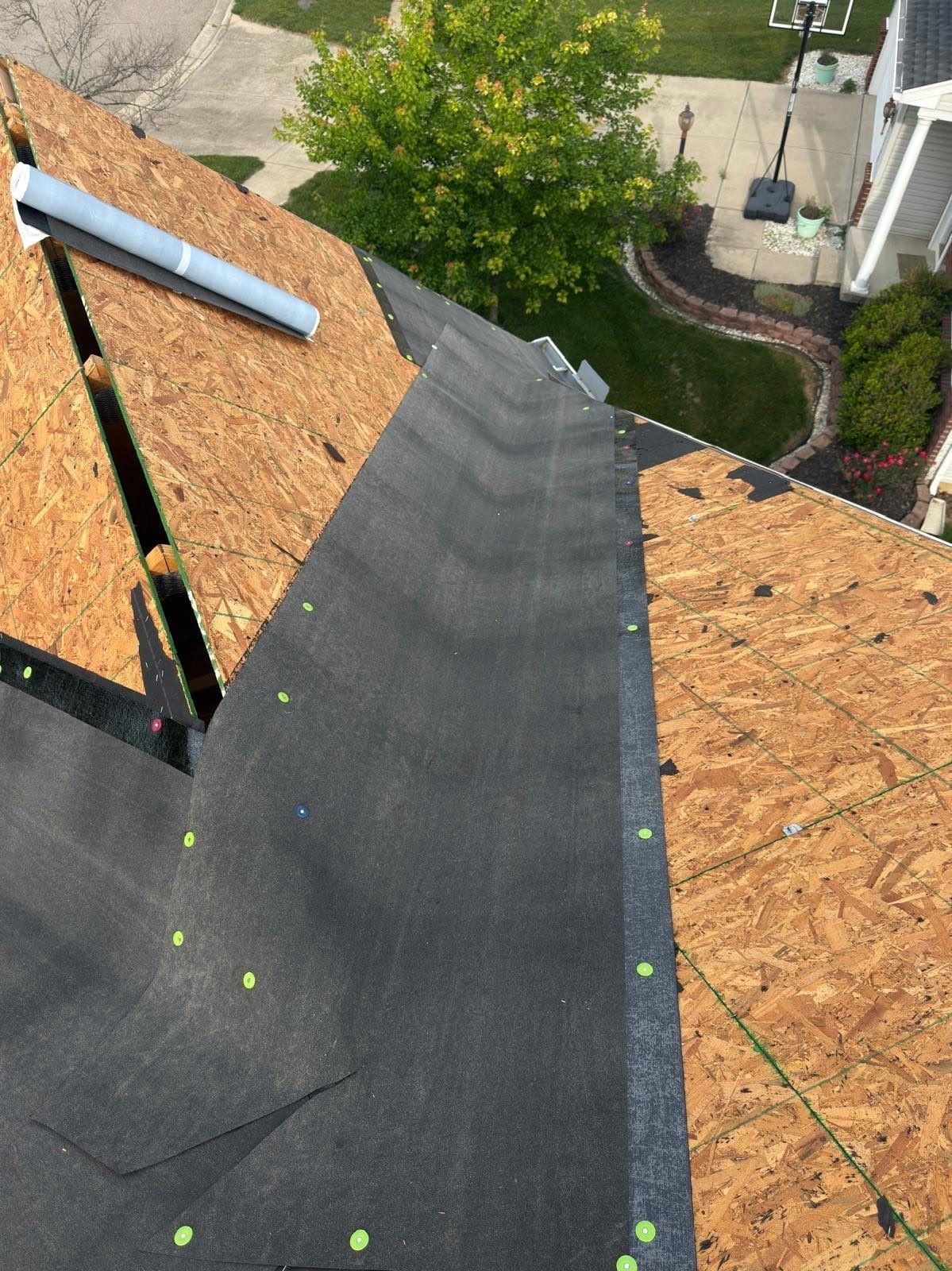 Ice and water shield running up between two roof planes above the front walk, Beavercreek, Ohio.