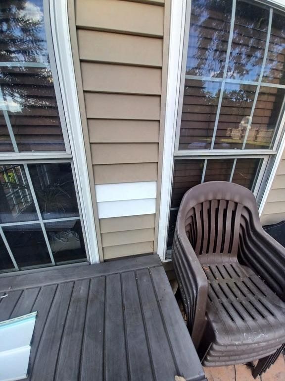A white patch in the siding between the back windows, Beavercreek, Ohio.