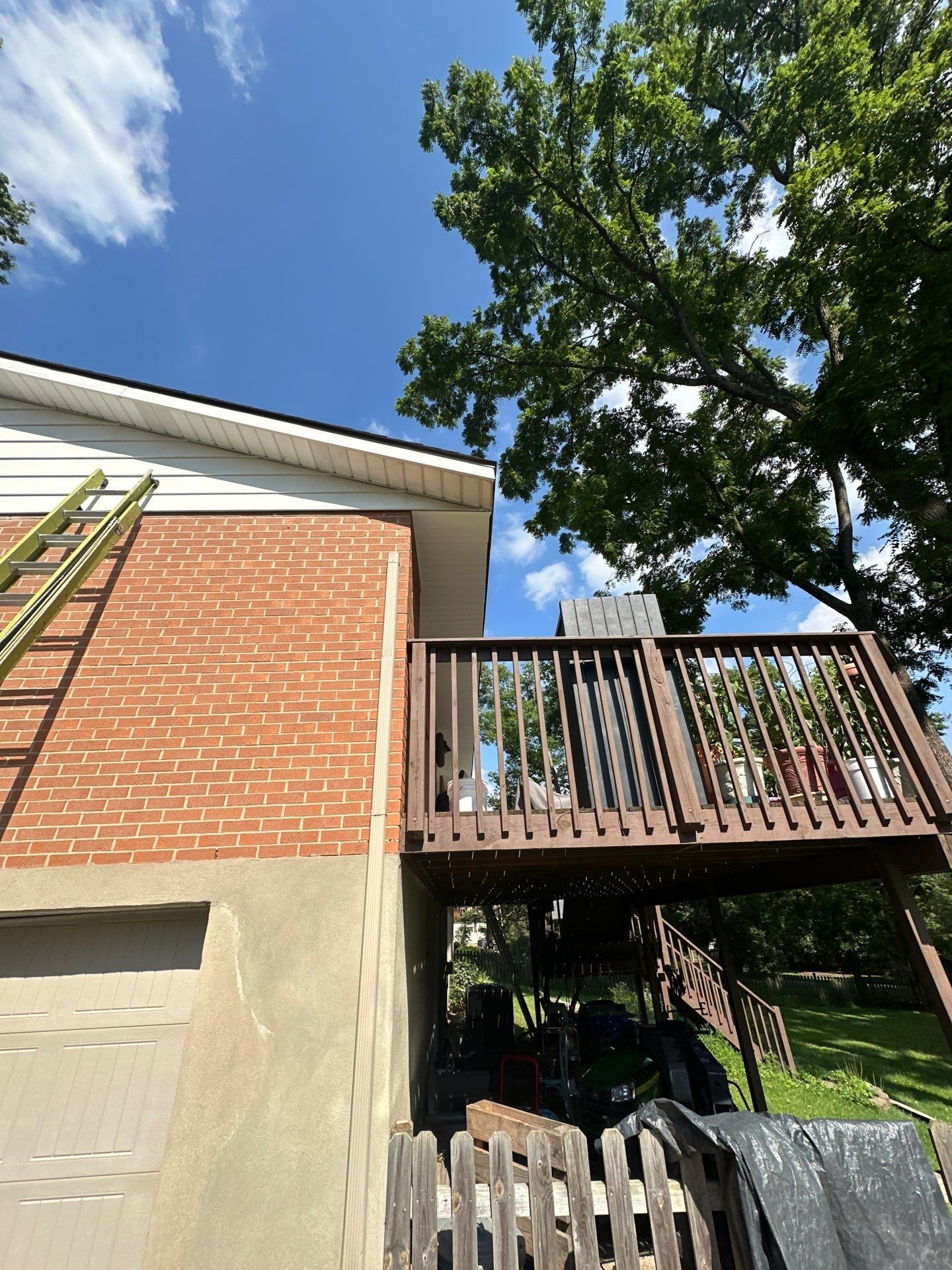 Ladder at the brick gable and raised deck