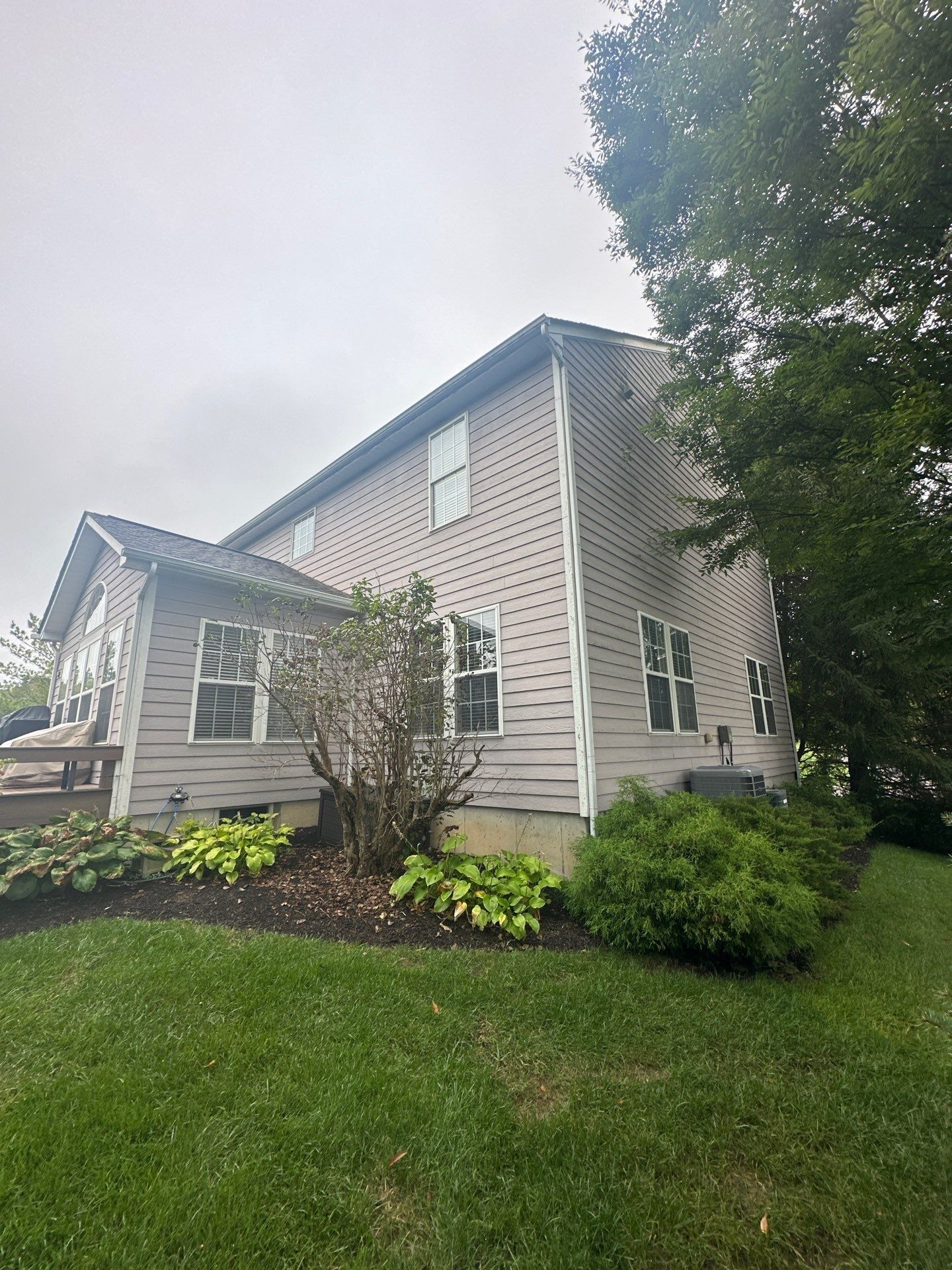 The far side of the house behind the shrubs at the inspection, Beavercreek, Ohio.
