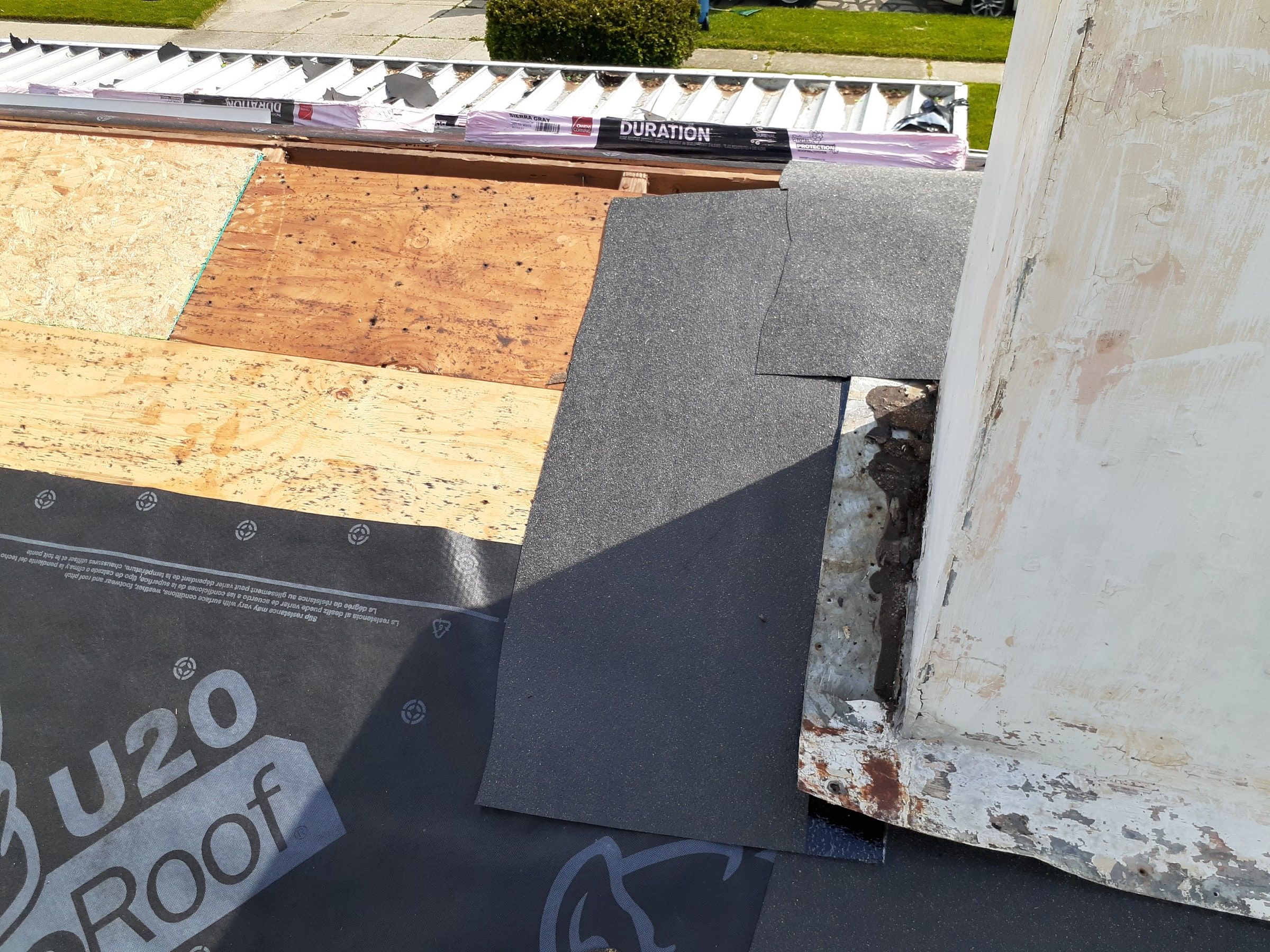 New step flashing pieces going on along the chimney, Huber Heights, Ohio.