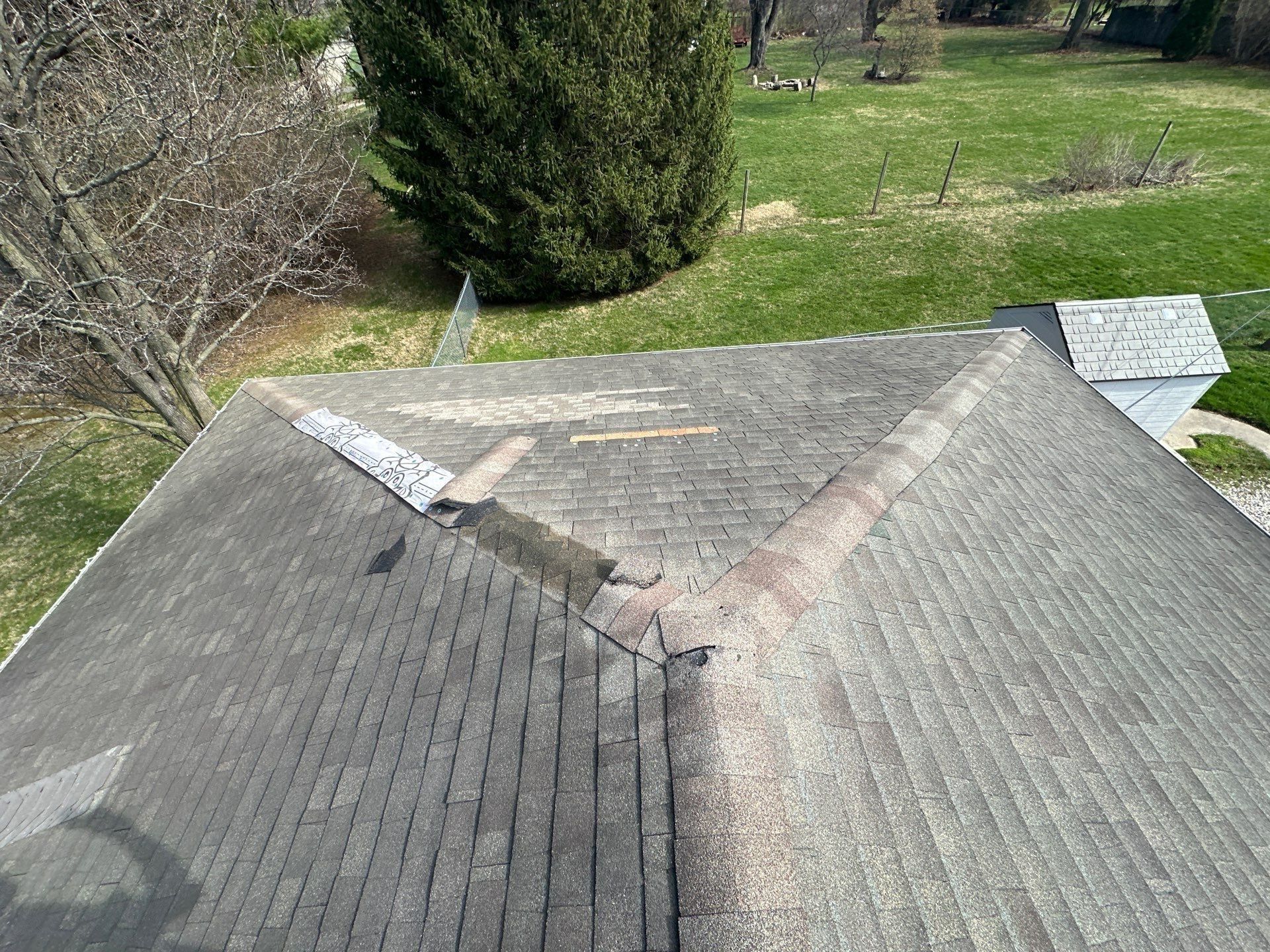 Wind damage at the top of the roof where the shingles came loose, Beavercreek, Ohio.