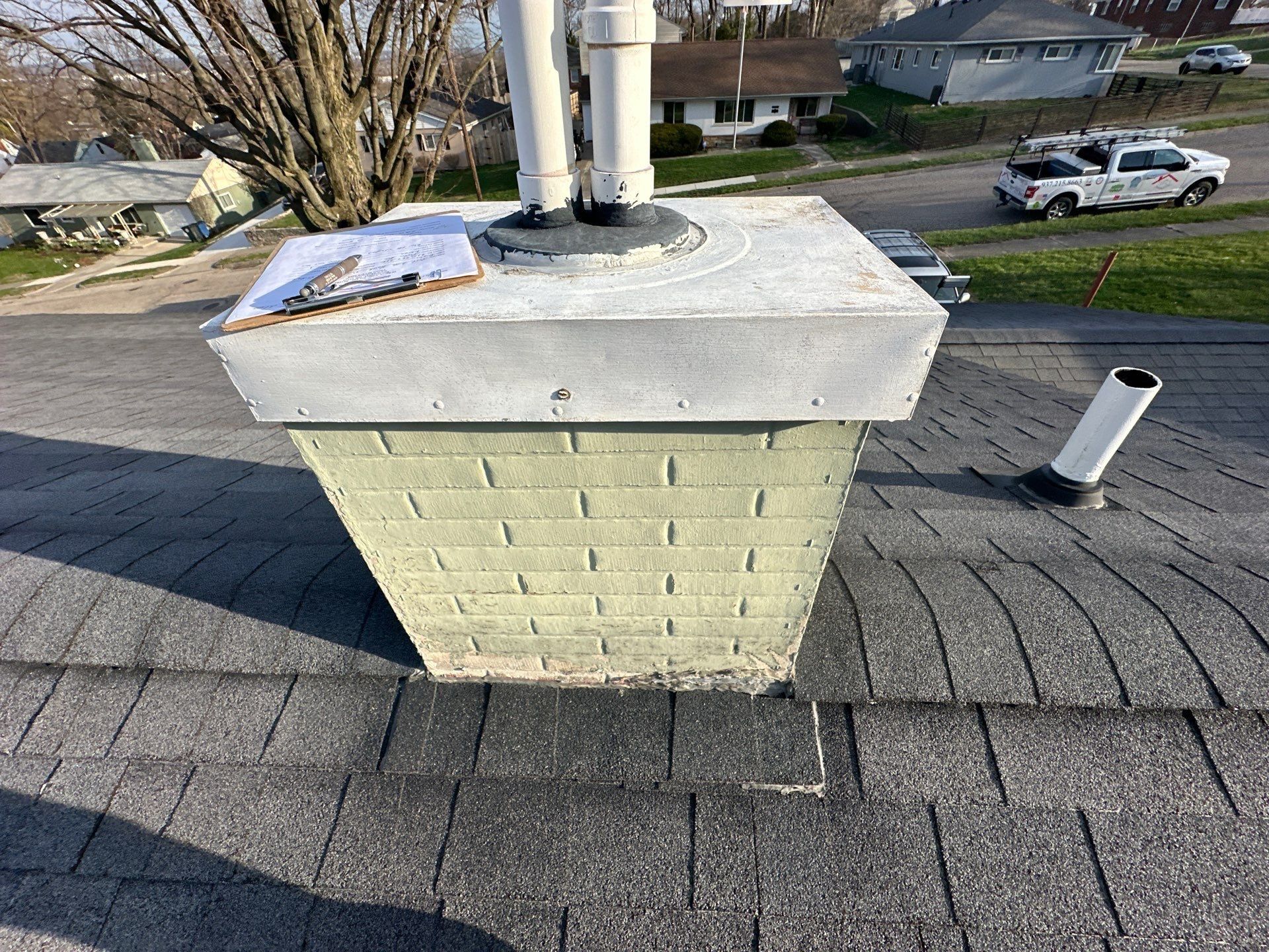 Flue chase, metal cap and clipboard