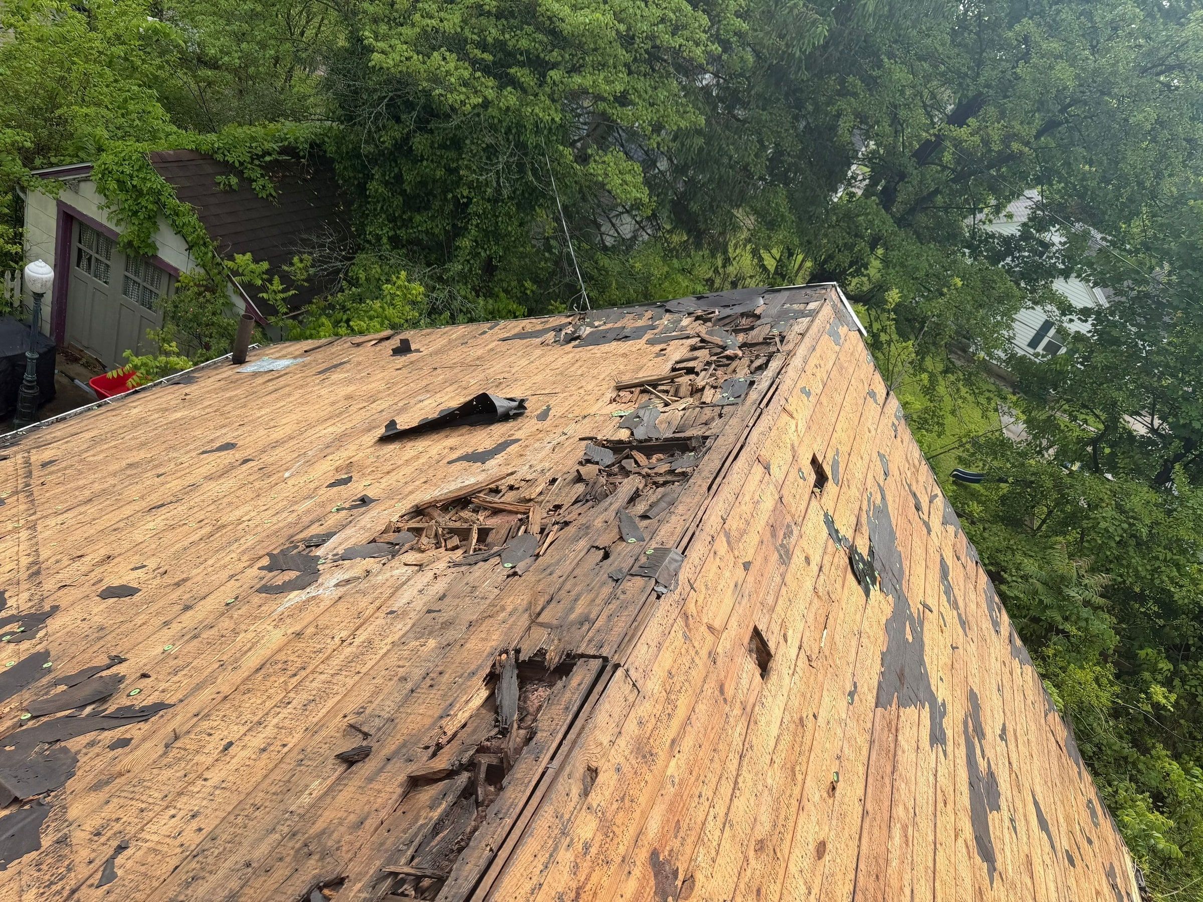Rotted planks on the stripped roof above the garage, Springfield, Ohio.