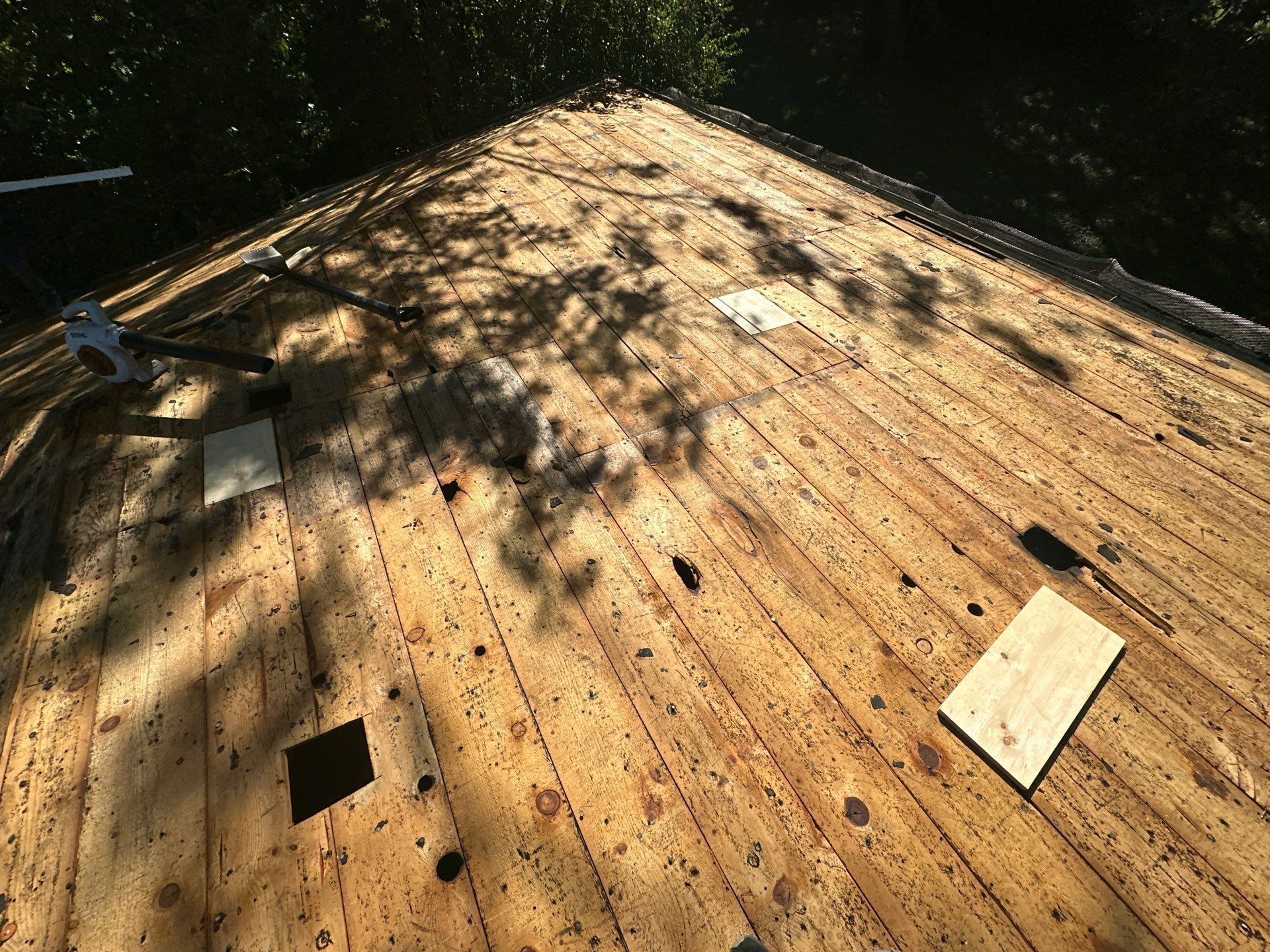 A new wood patch set into the old plank deck, Kettering, Ohio.