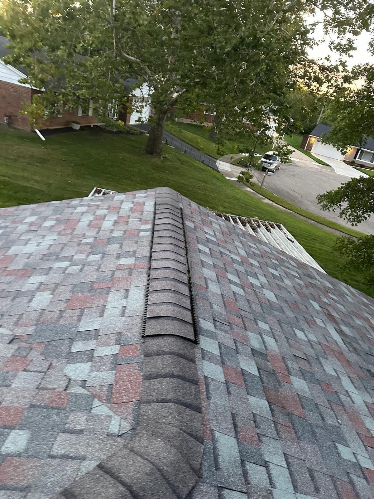 New ridge cap shingles at the top of the finished roof, West Carrollton, Ohio.