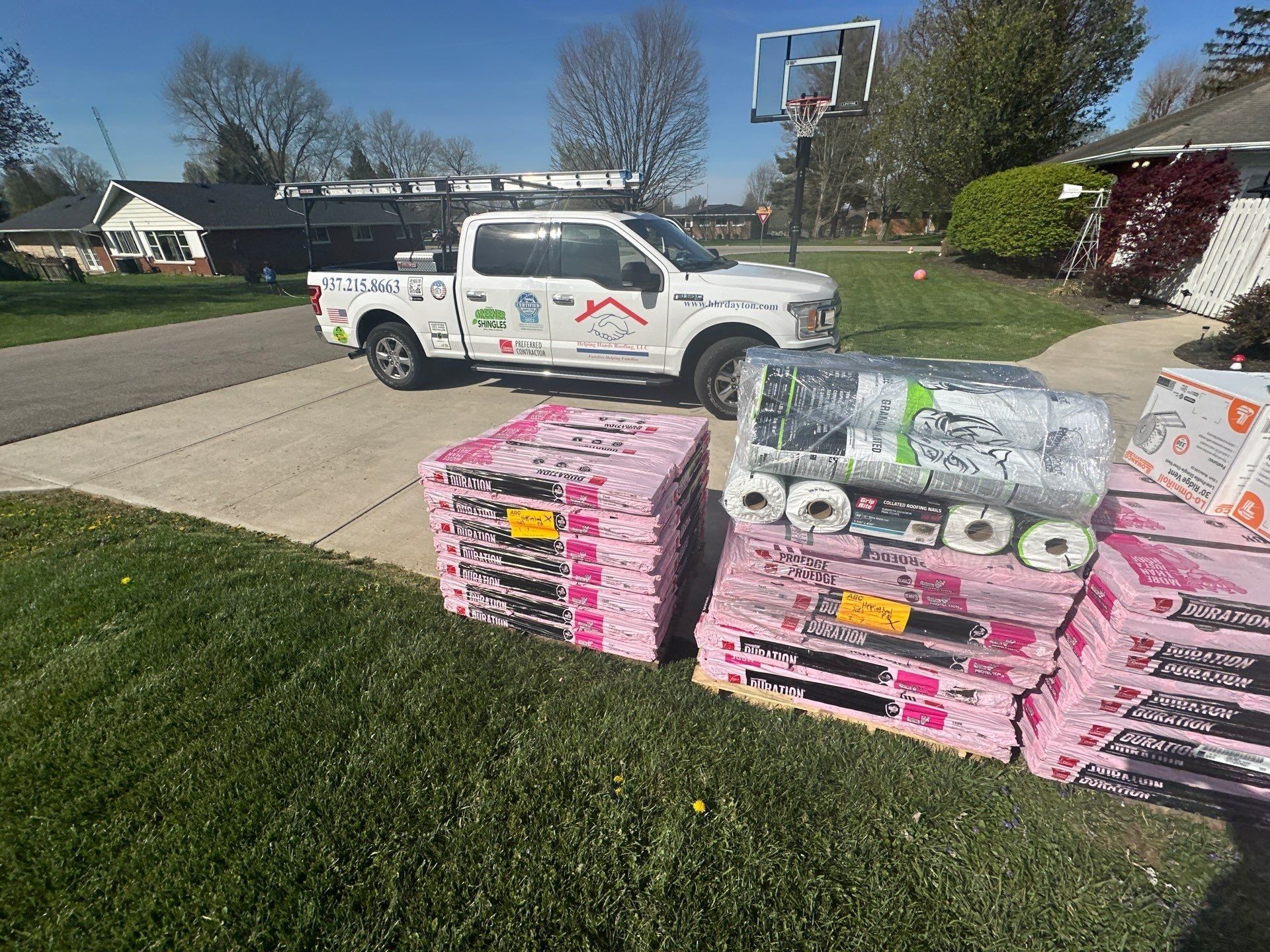 Shingles and underlayment delivered beside the driveway, Beavercreek, Ohio.