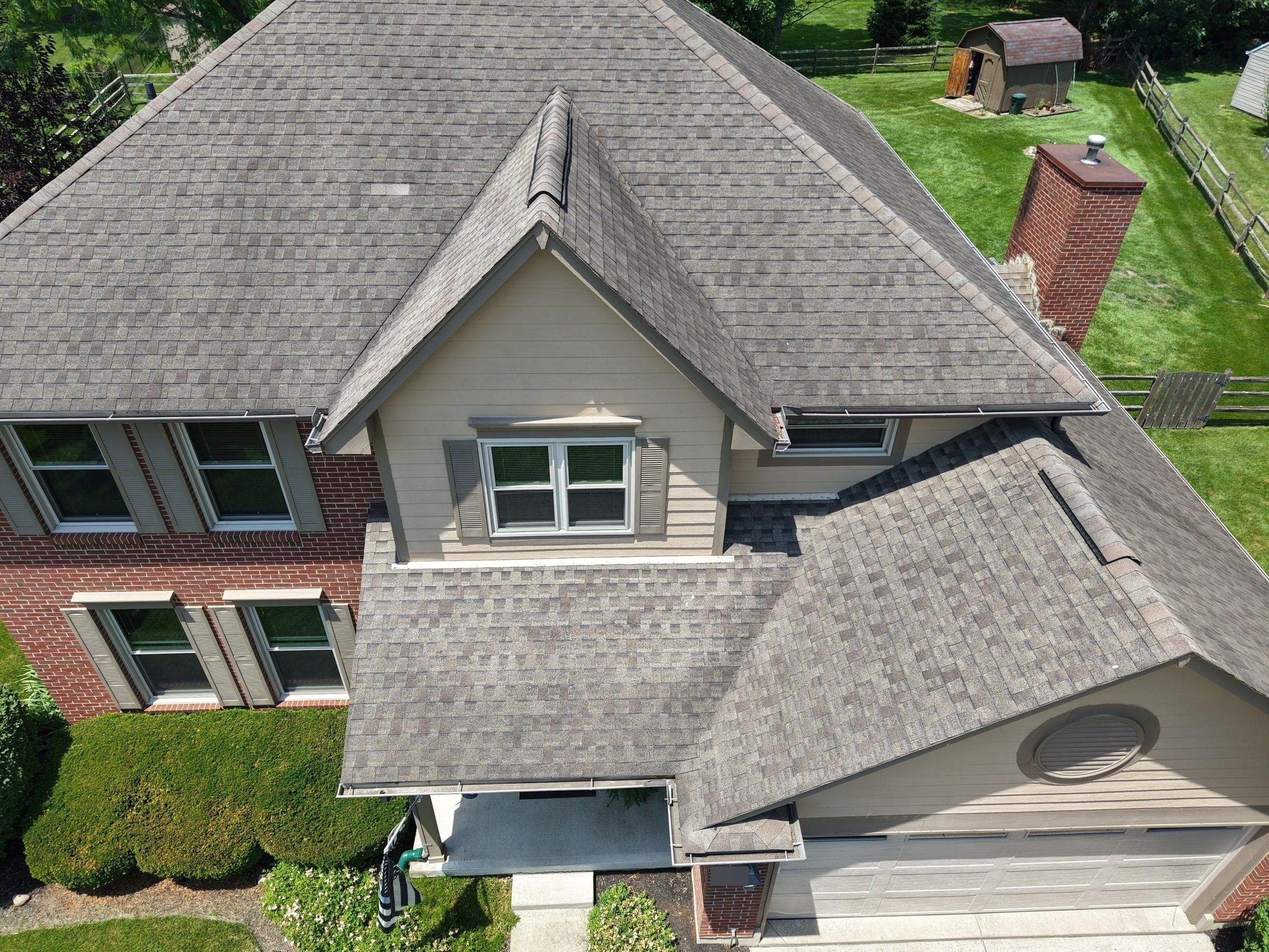 Drone photo of weathered shingles on the old roof, including an area repaired earlier, Beavercreek, Ohio.