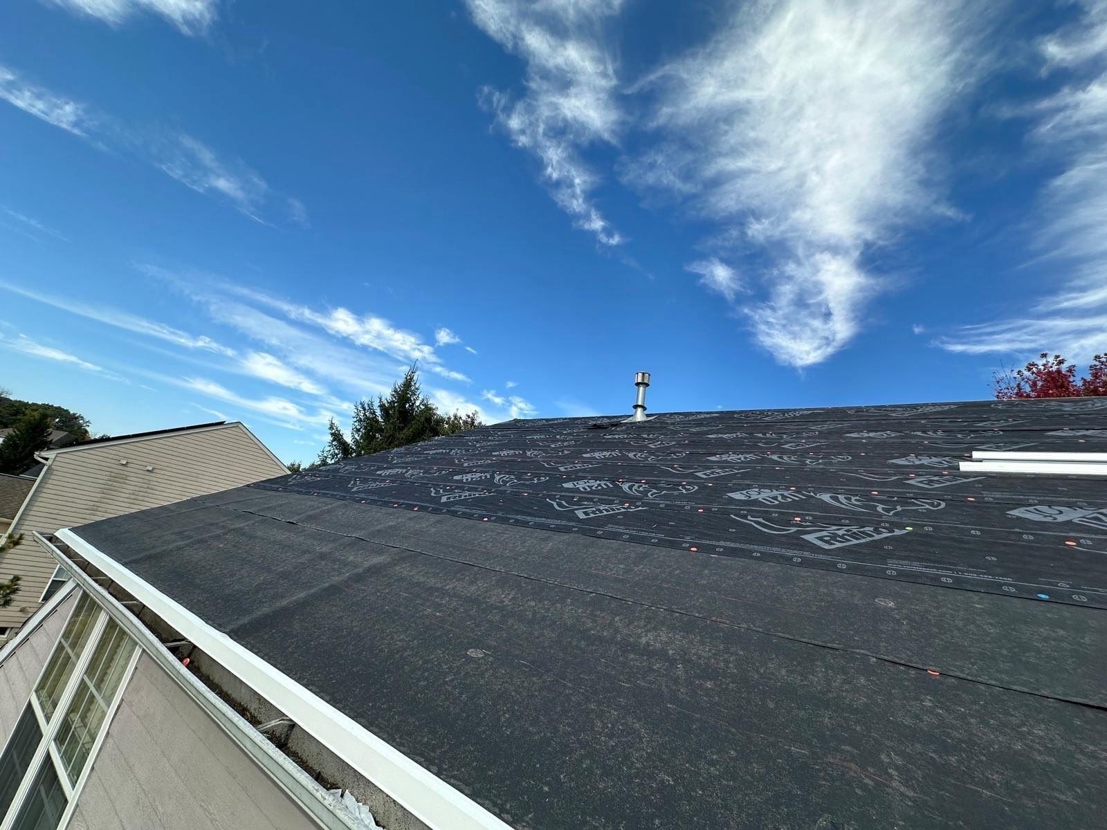 Synthetic underlayment over a slope, with white metal along the edge, Beavercreek, Ohio.