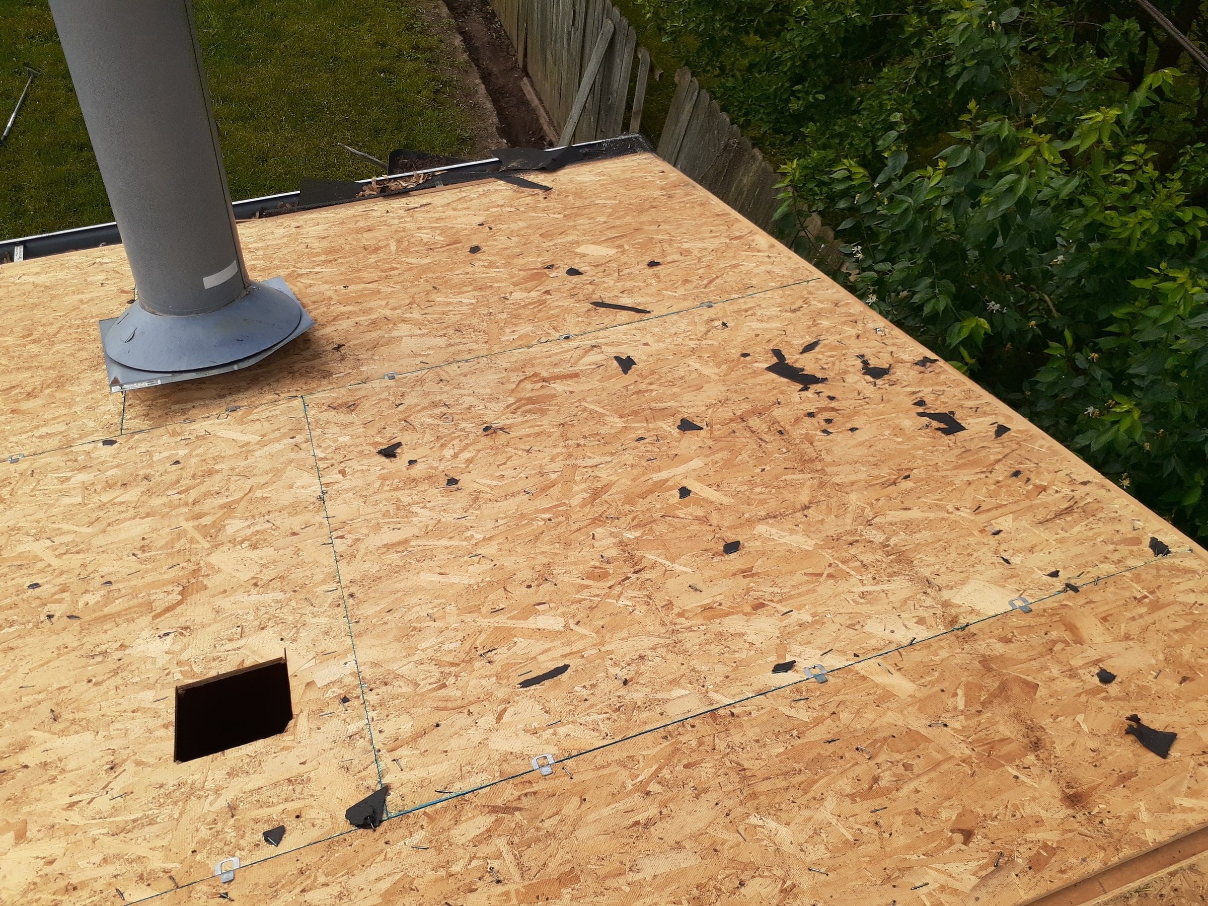 New OSB across the garage roof around its vent stack, Huber Heights, Ohio.