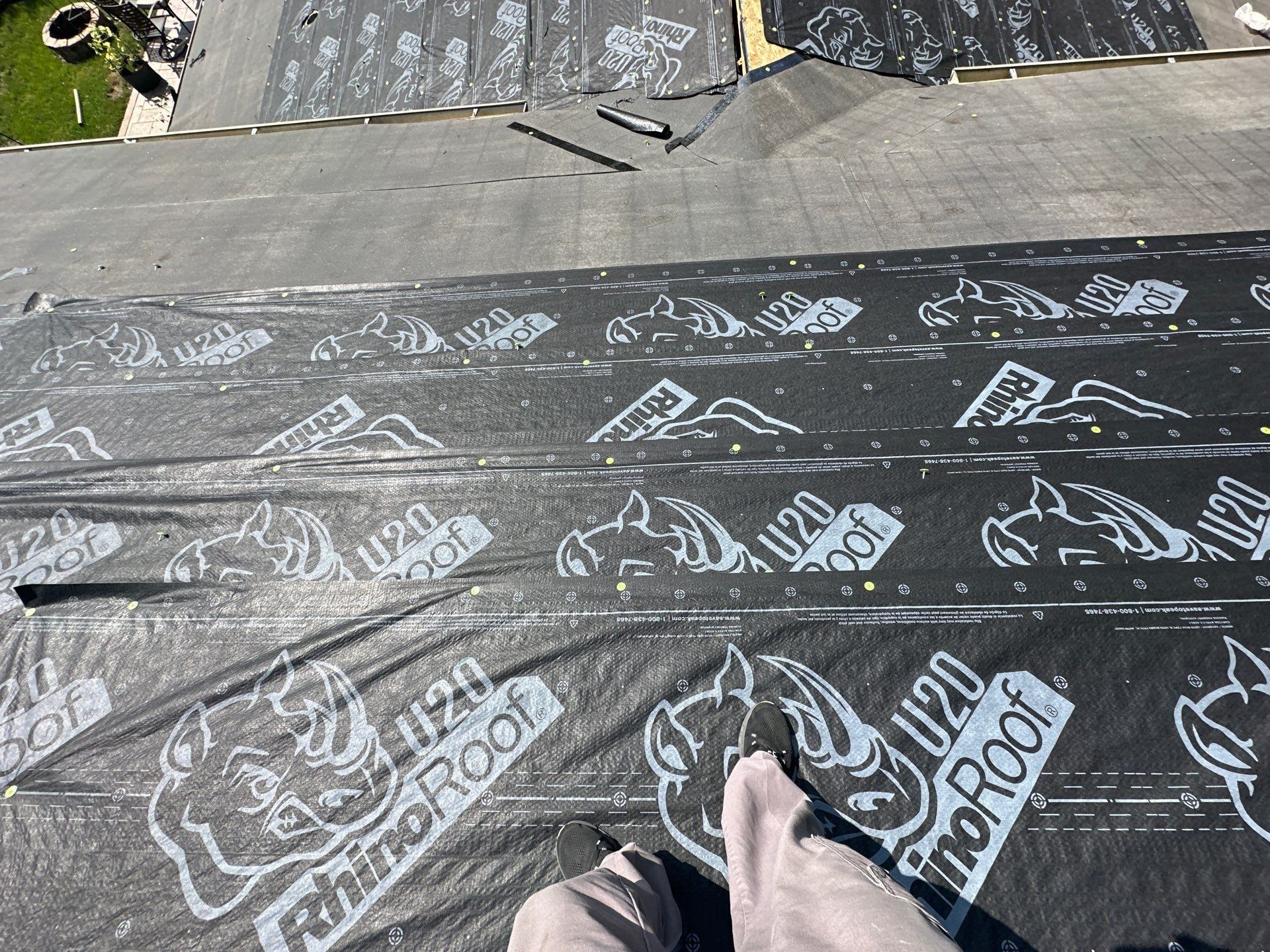 Overlapping courses of synthetic underlayment across the roof, Dayton, Ohio.