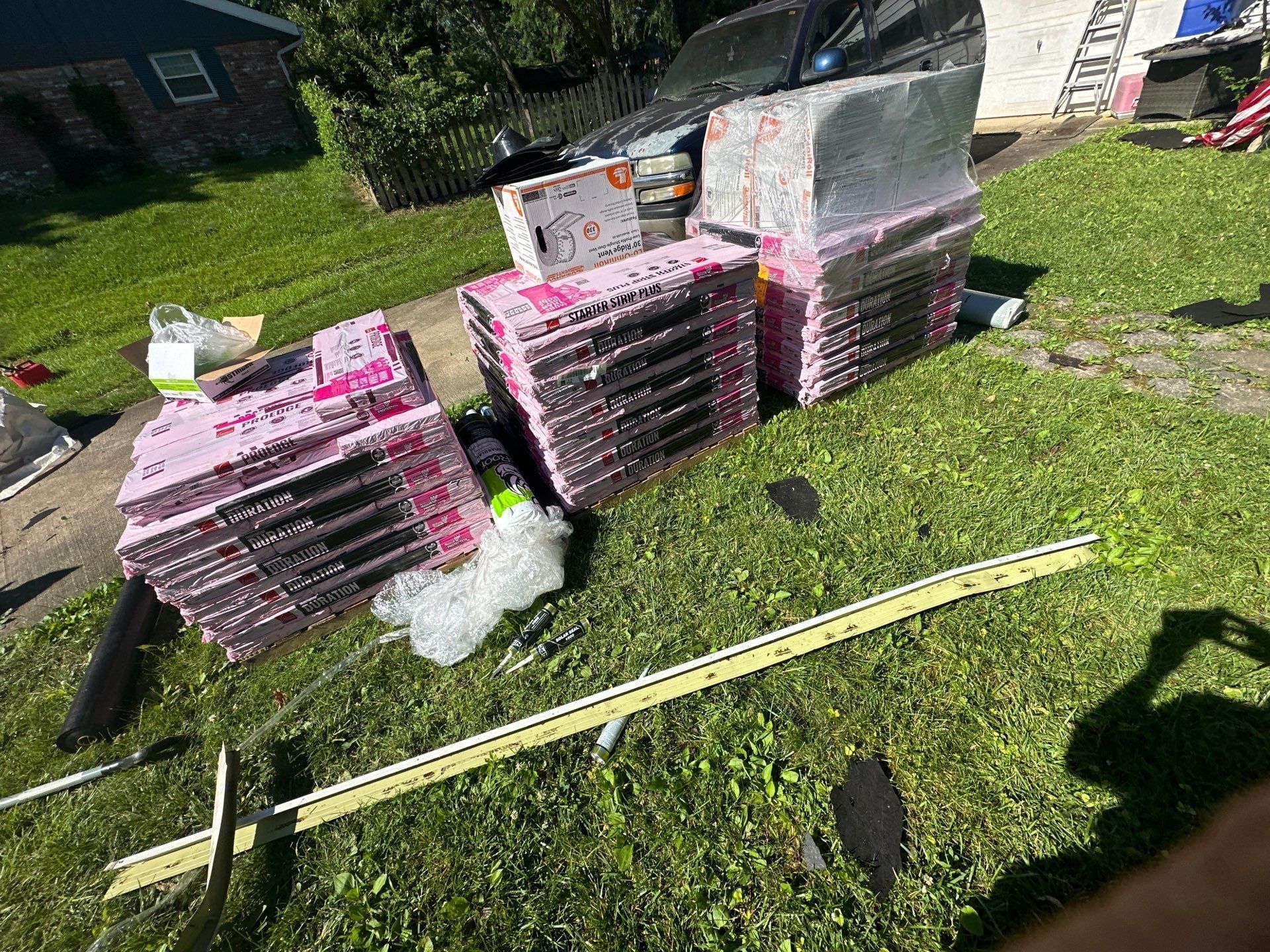 Shingle bundles and roofing materials delivered to the side yard, Beavercreek, Ohio.