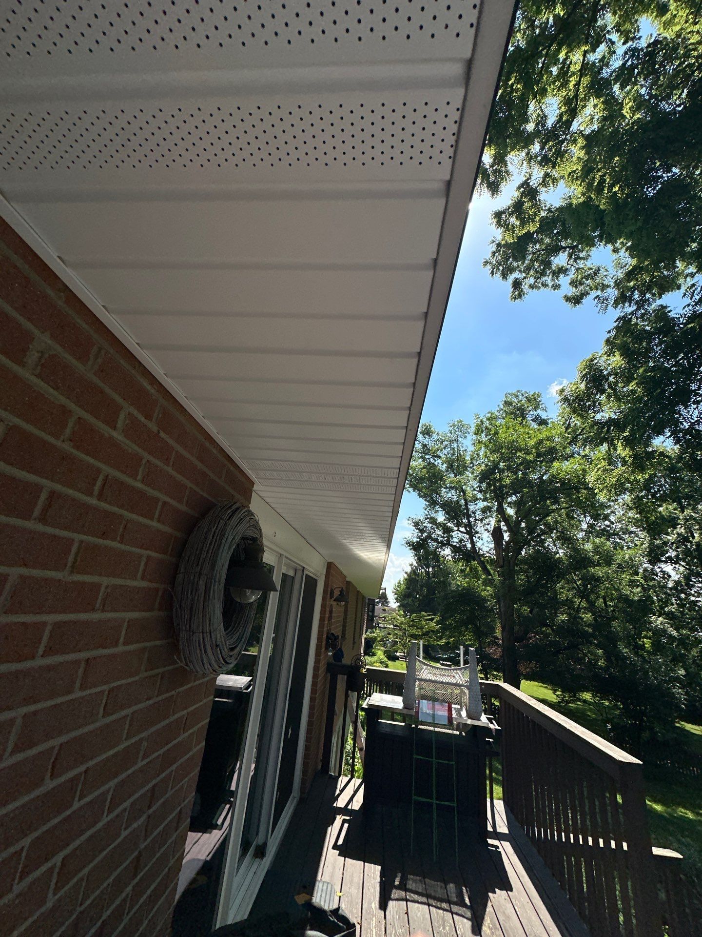 Completed white fascia and vented soffit along the eave of a Beavercreek, Ohio home.