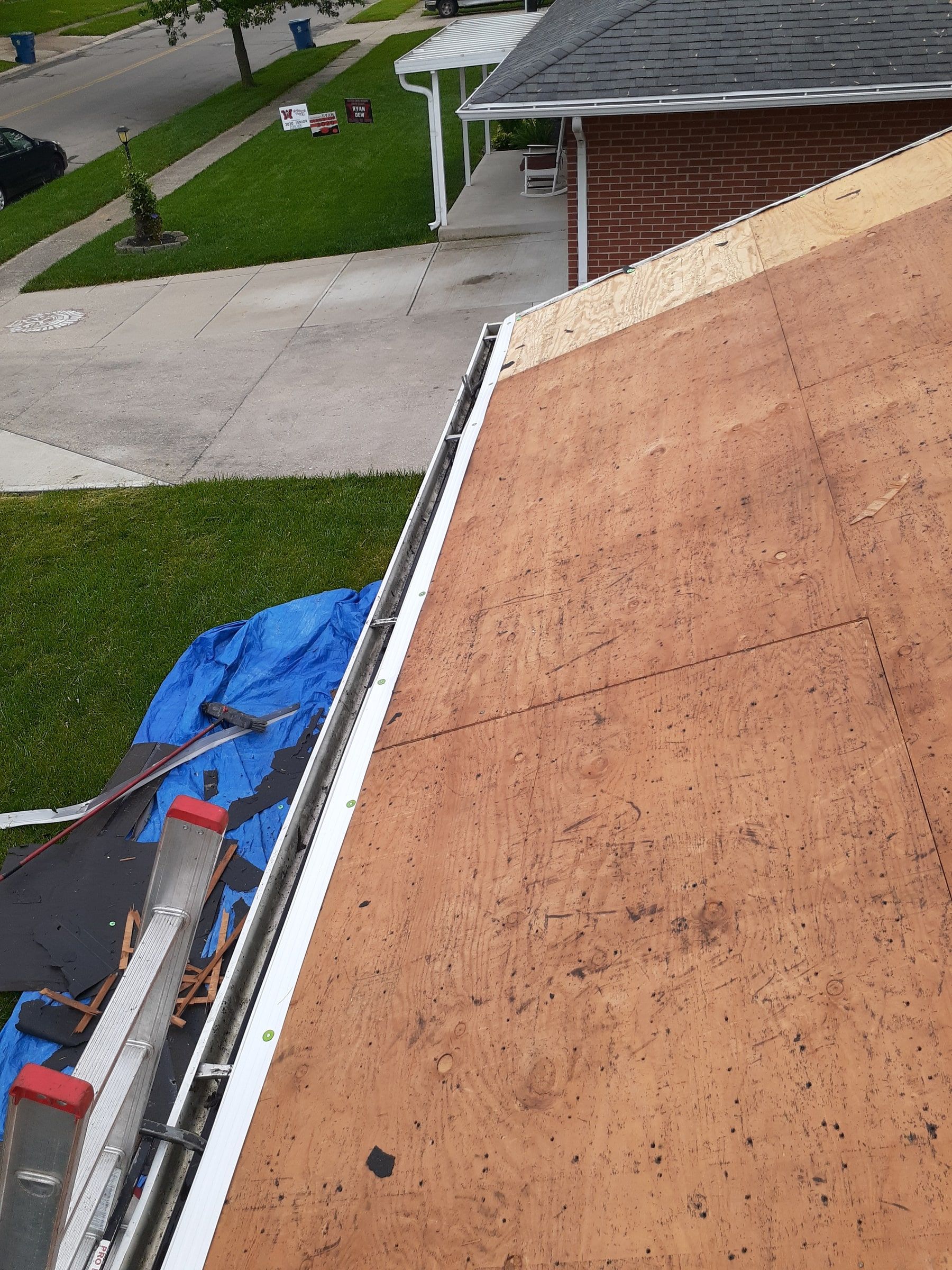 The bare deck running along the gutter on the side of the house, Huber Heights, Ohio.