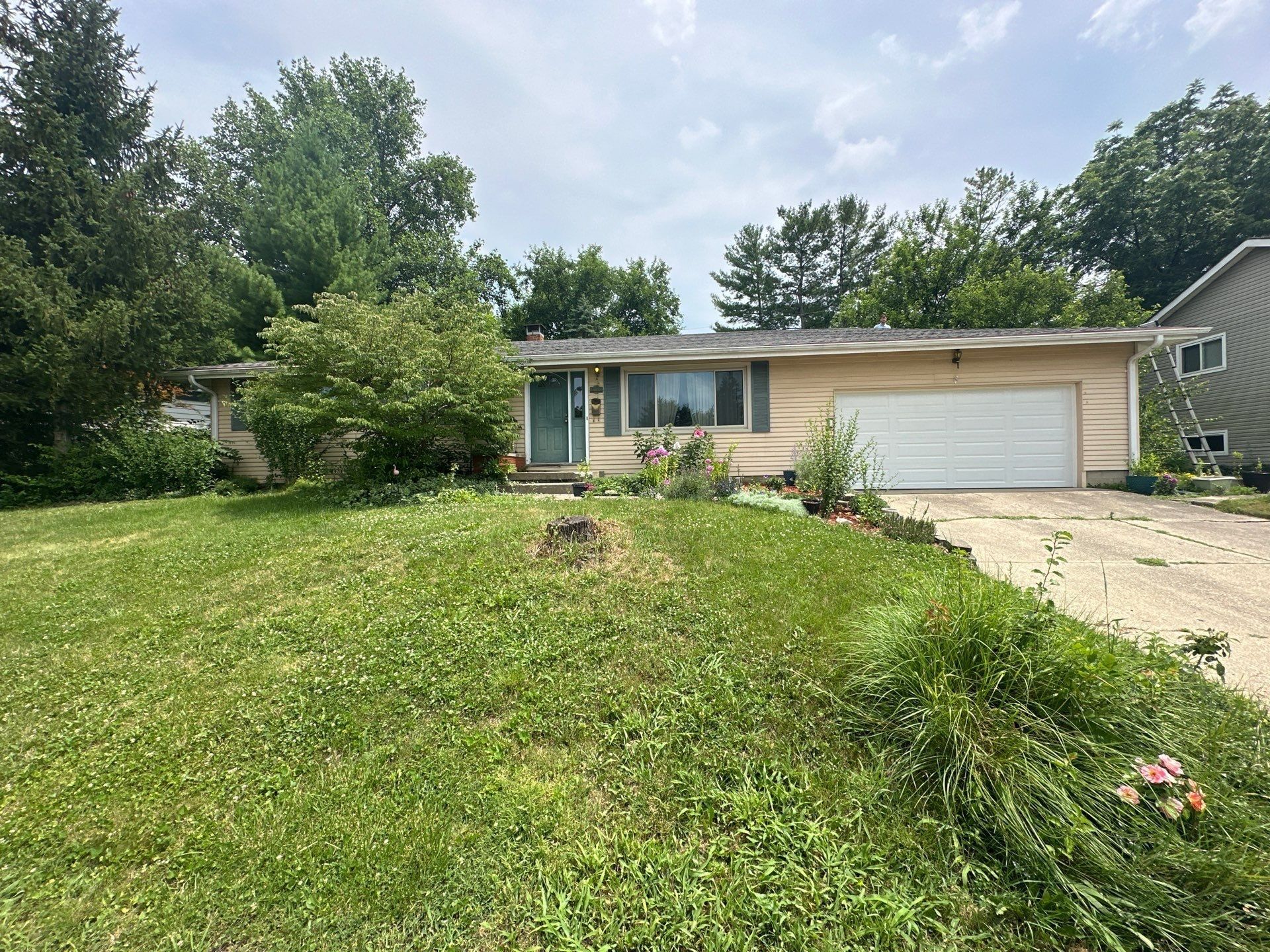 The front of the ranch house and its garage from the lawn, Fairborn, Ohio.
