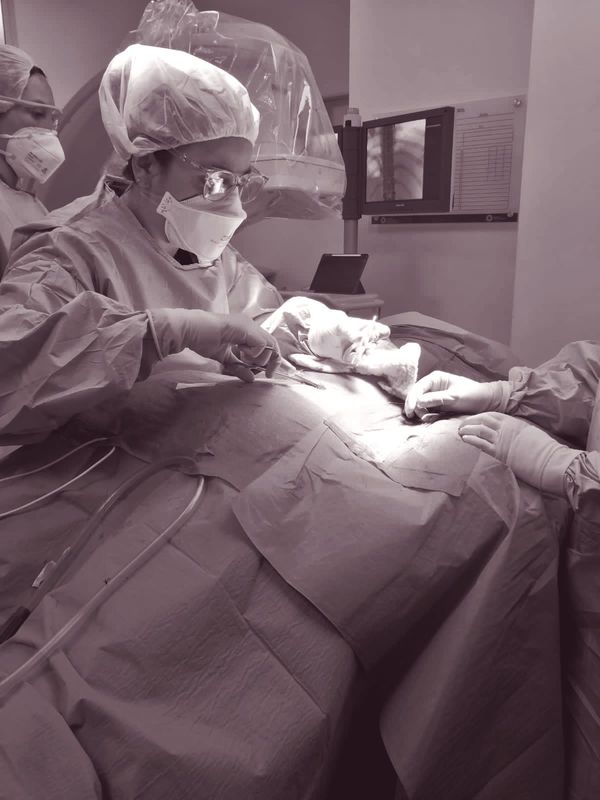Hands of a patient supported during a pain-management consultation