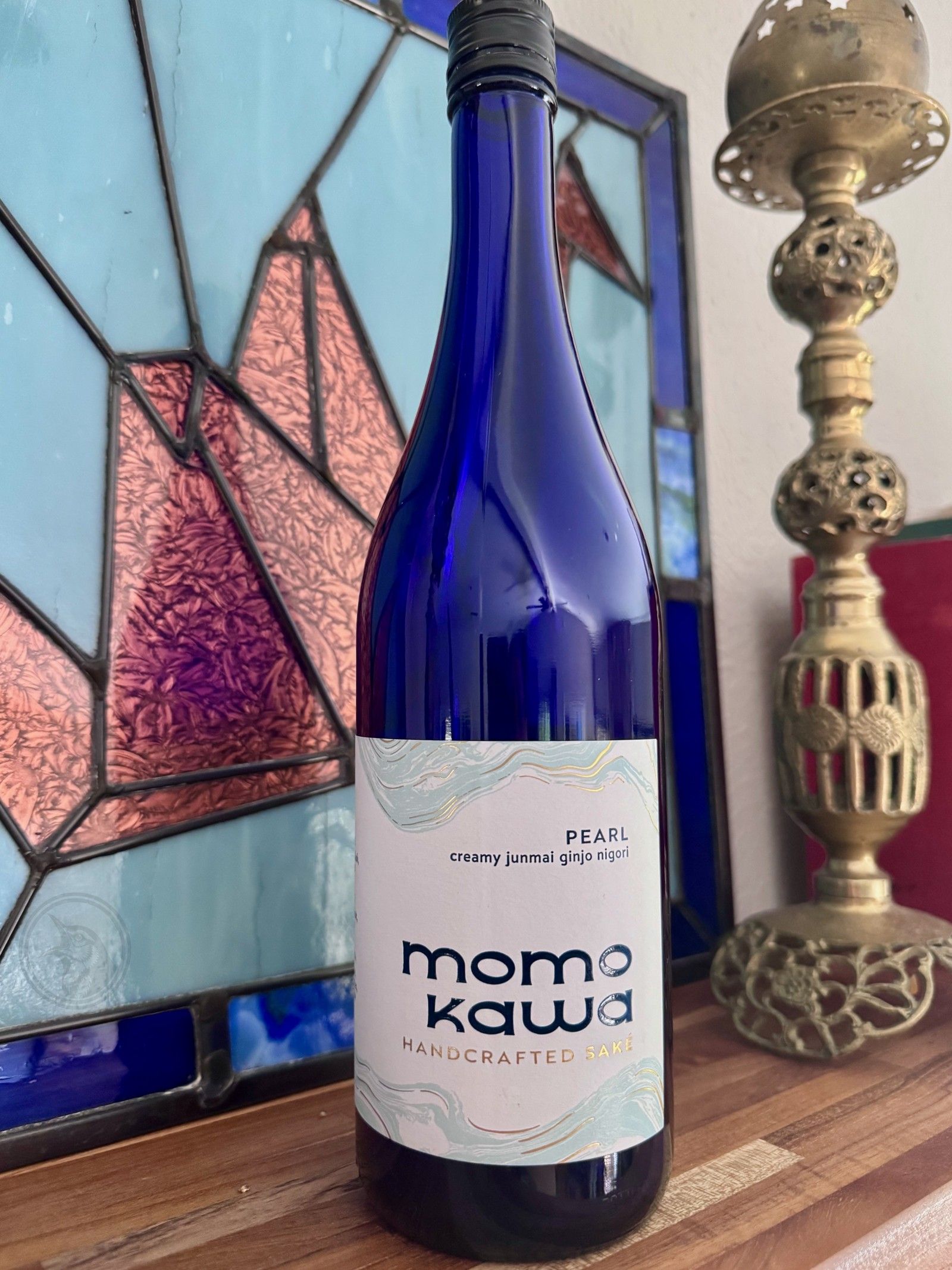 SakeOne Momokawa Pearl Junmai Ginjo Nigori sake bottle