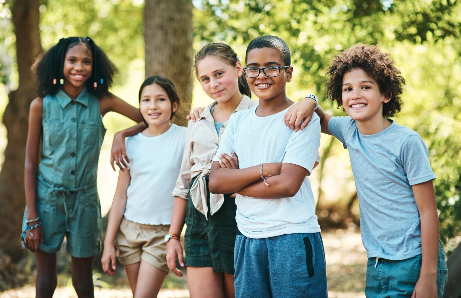 Group of kids smiling together.