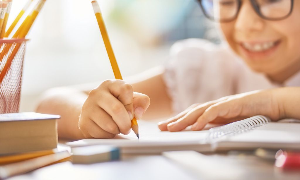 A child writing in a notebook