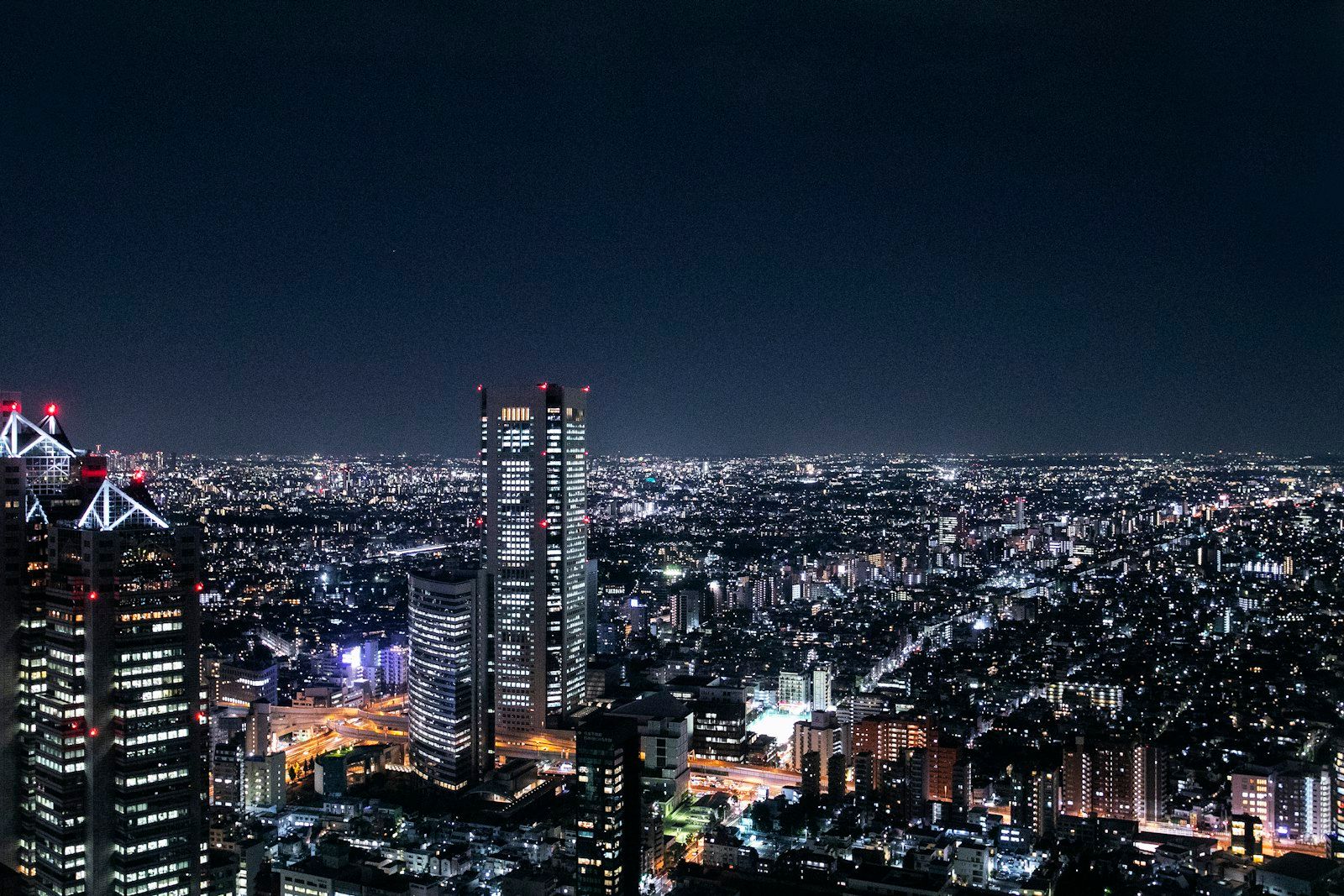 Aerial view of the Shinjuku skyline at night from the Tokyo Metropolitan Government observatory
