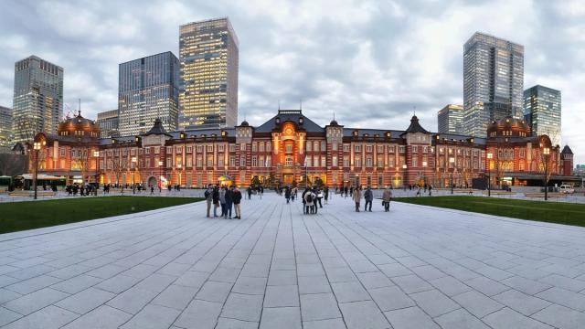 Tokyo Station's red-brick Marunouchi facade at sunset