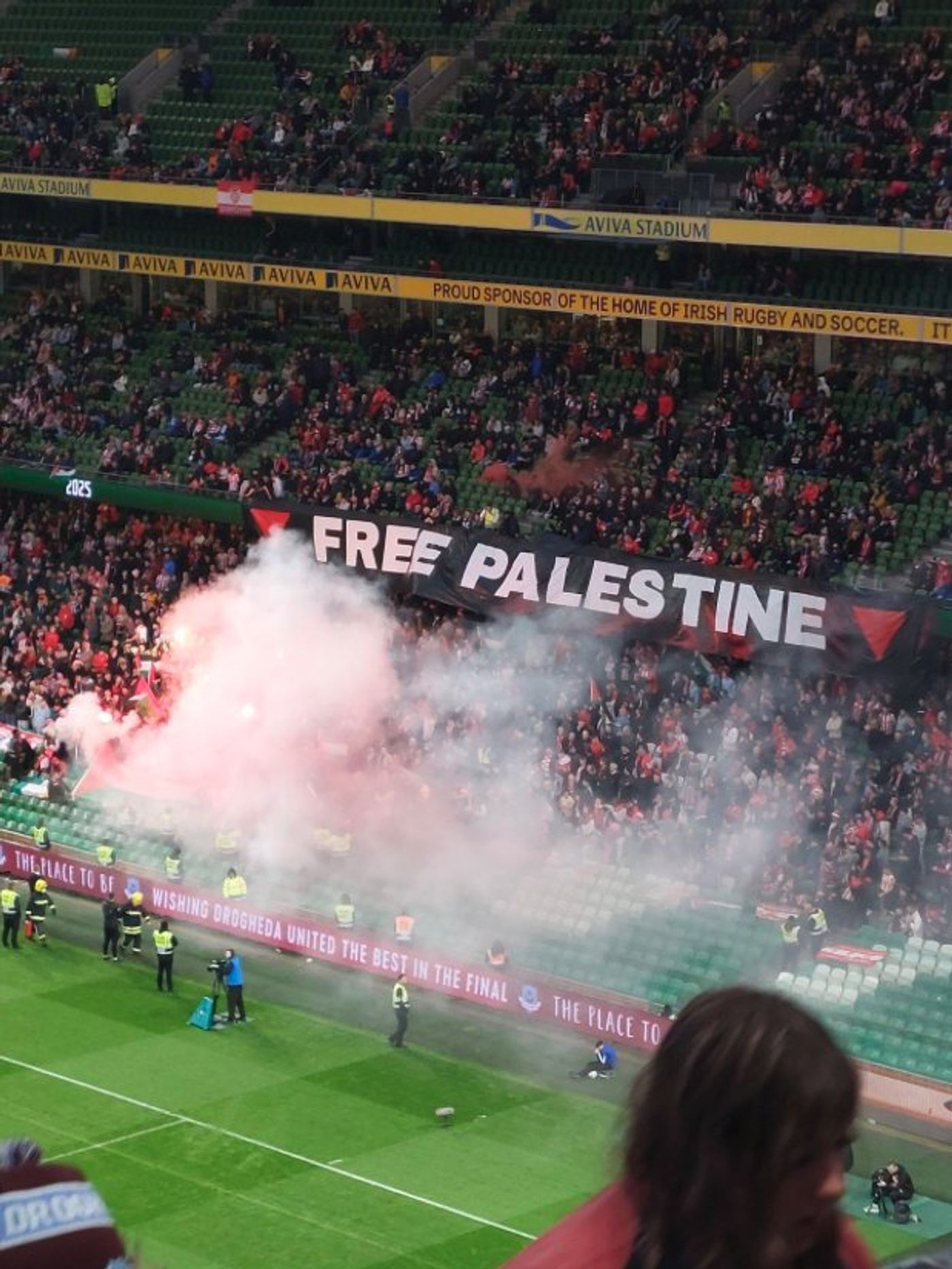 Derry City ultras hold a 'Free Palestine' banner at an Irish League match