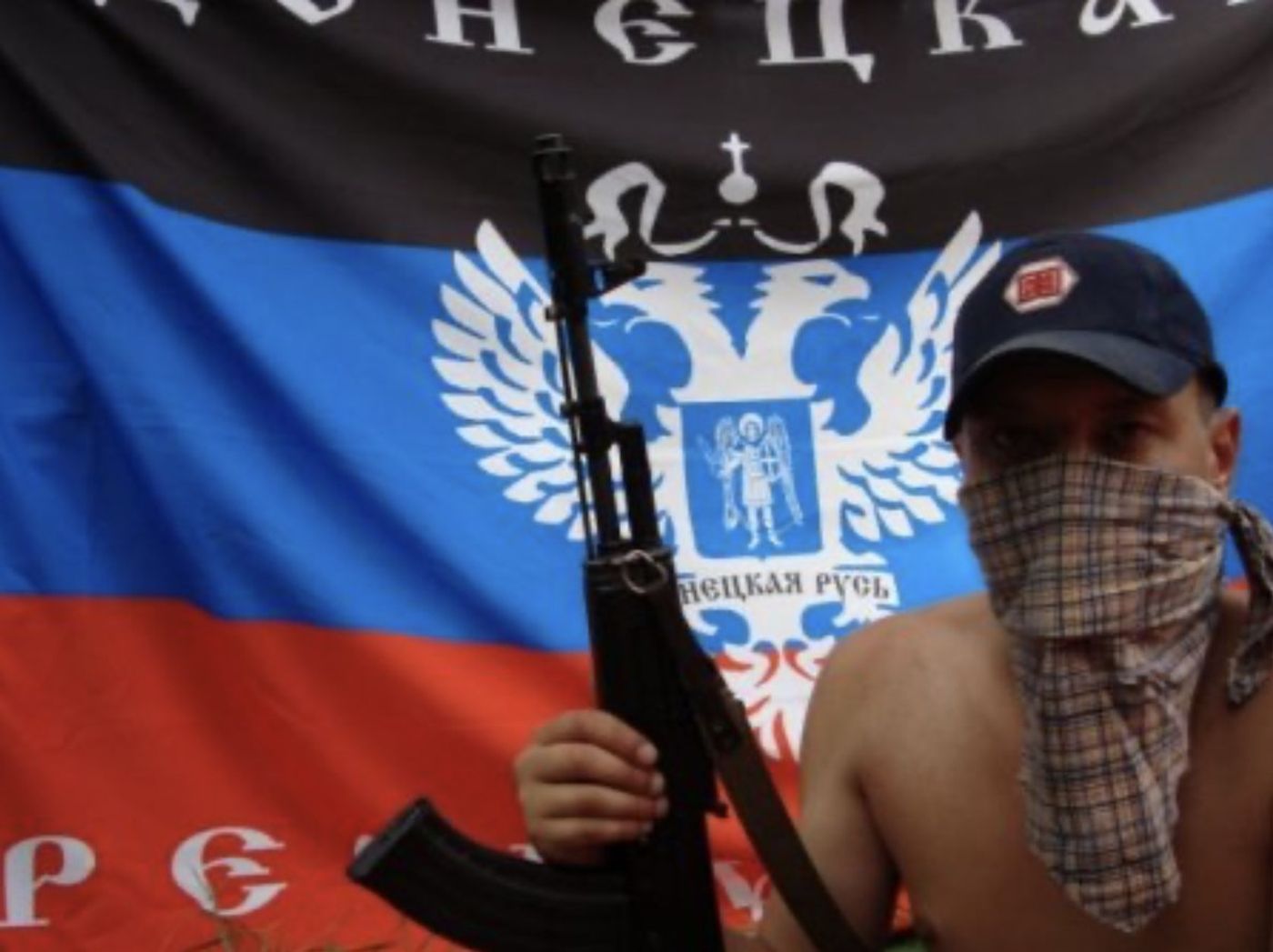 Figure 4: A member of the summer camp poses with an assault rifle