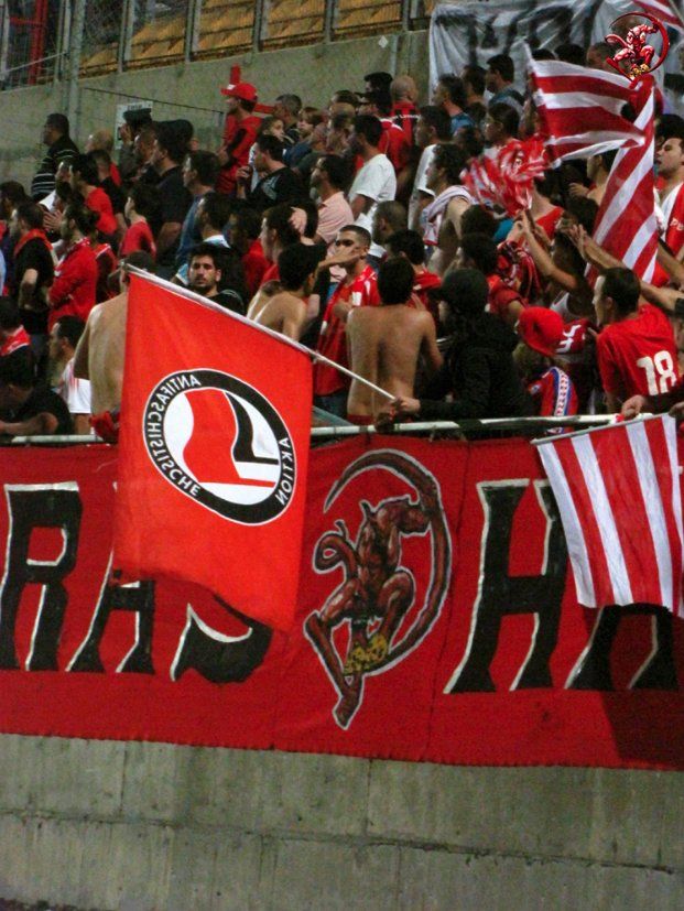 A Hapoel fan waving the flag of Anti-Fascist Action (AFA)