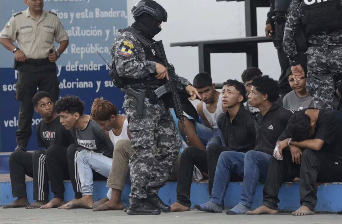 Ecuadorian soldiers detain the men who stormed the TC Television studio