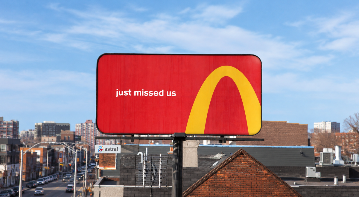 McDonald’s outdoor advertising using cropped golden arches as directions to a restaurant.