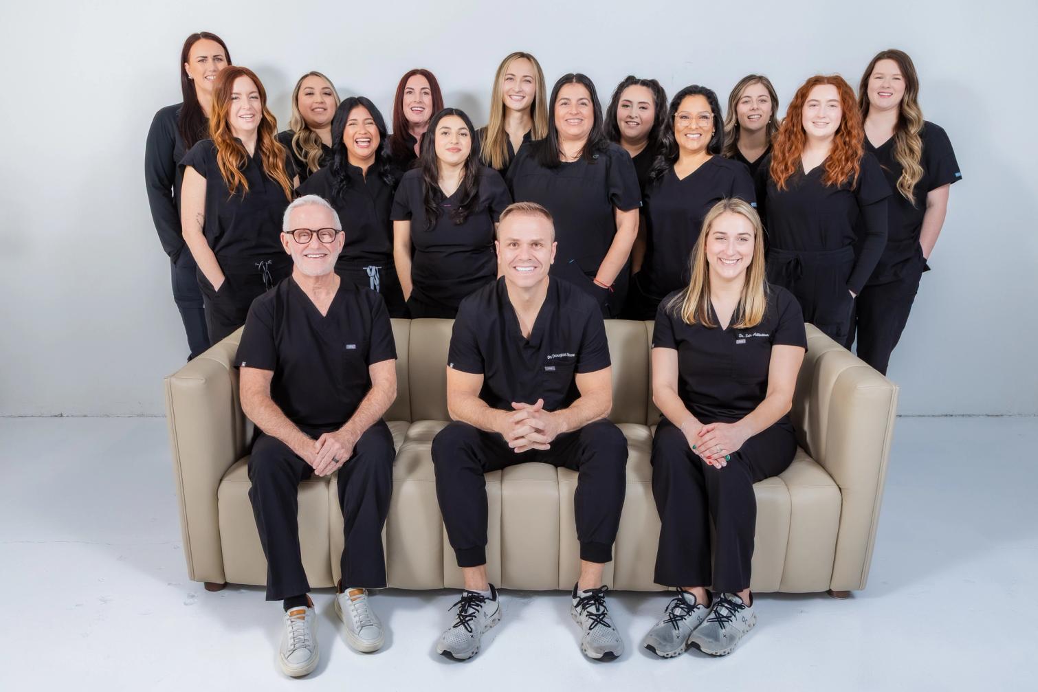 Group photo of people wearing scrubs