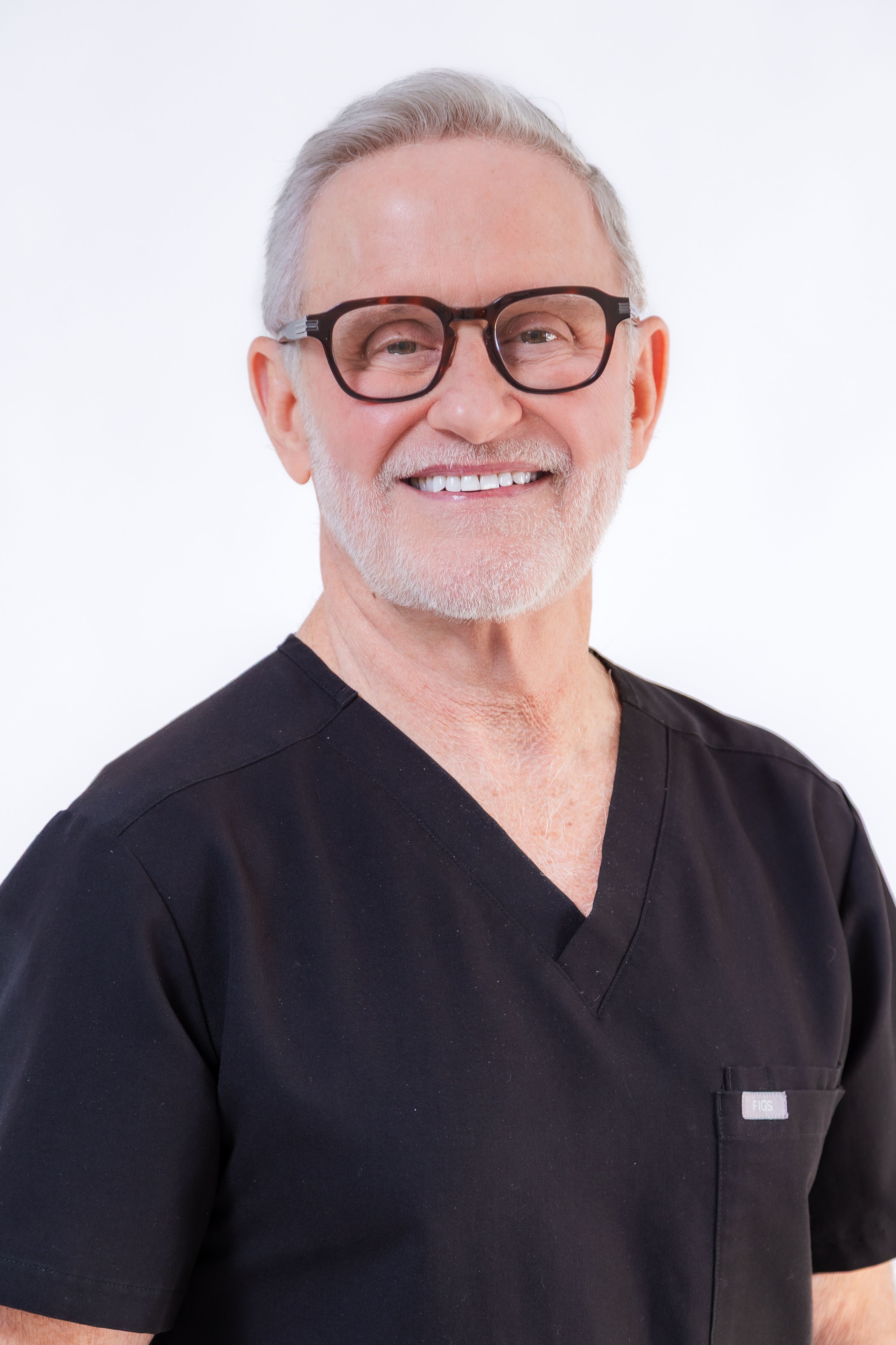 Headshot of man wearing glasses