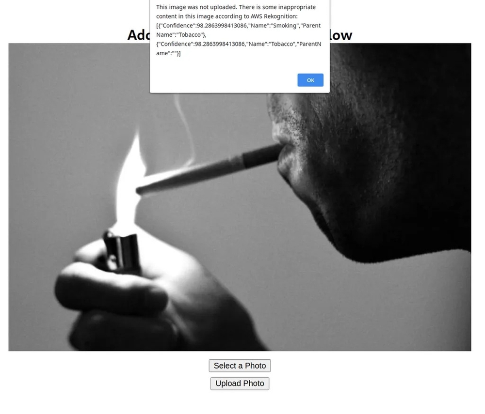 Web app with Guy smoking, showing AWS Rekognition classifying it as inappropriate 
