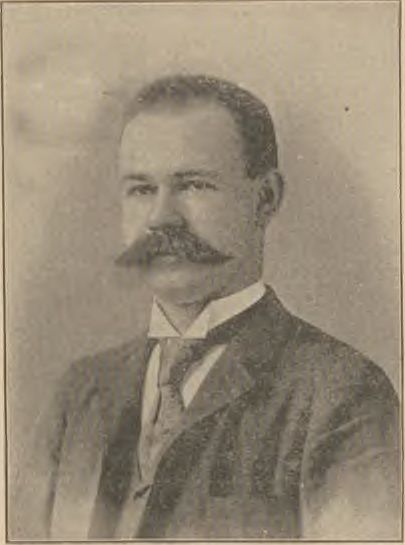 Herman Hollerith, with a moustache and dark suit, in a portrait printed with the 1891 account of his system.