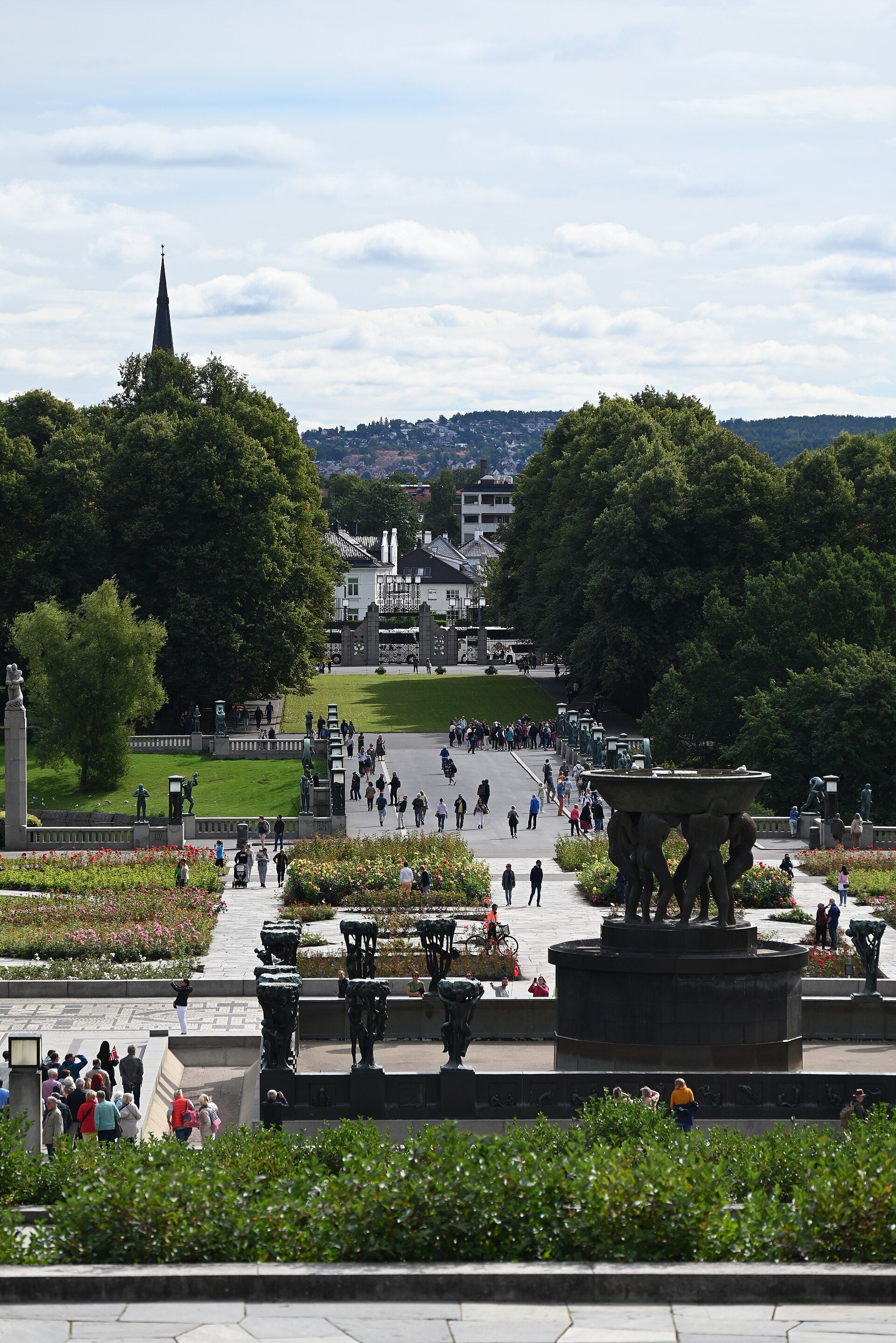 A view east from the Monolith steps across the fountain, flower beds, lawns and sculpture bridge towards the entrance.