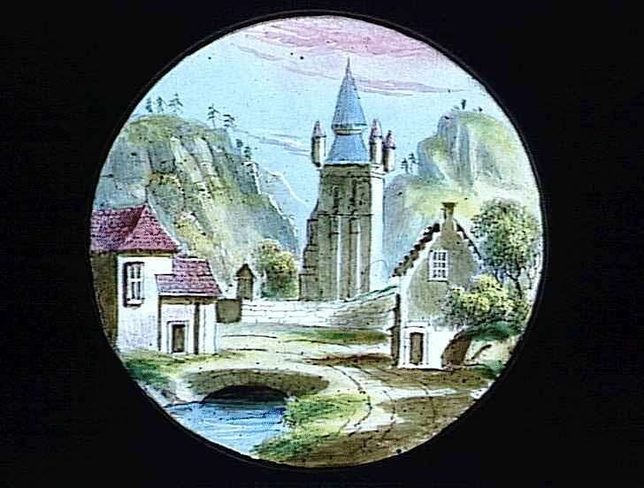 A circular coloured scene contains a bridge over water, a tall central tower and buildings among green trees and mountains.