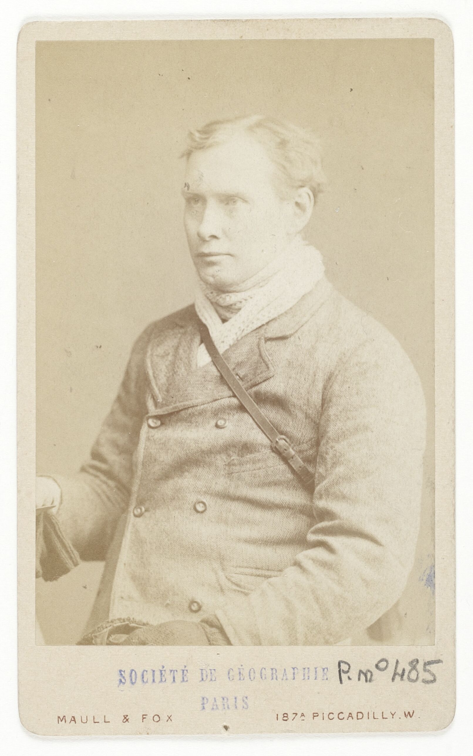 Edward Whymper seated in a studio portrait by Maull and Fox