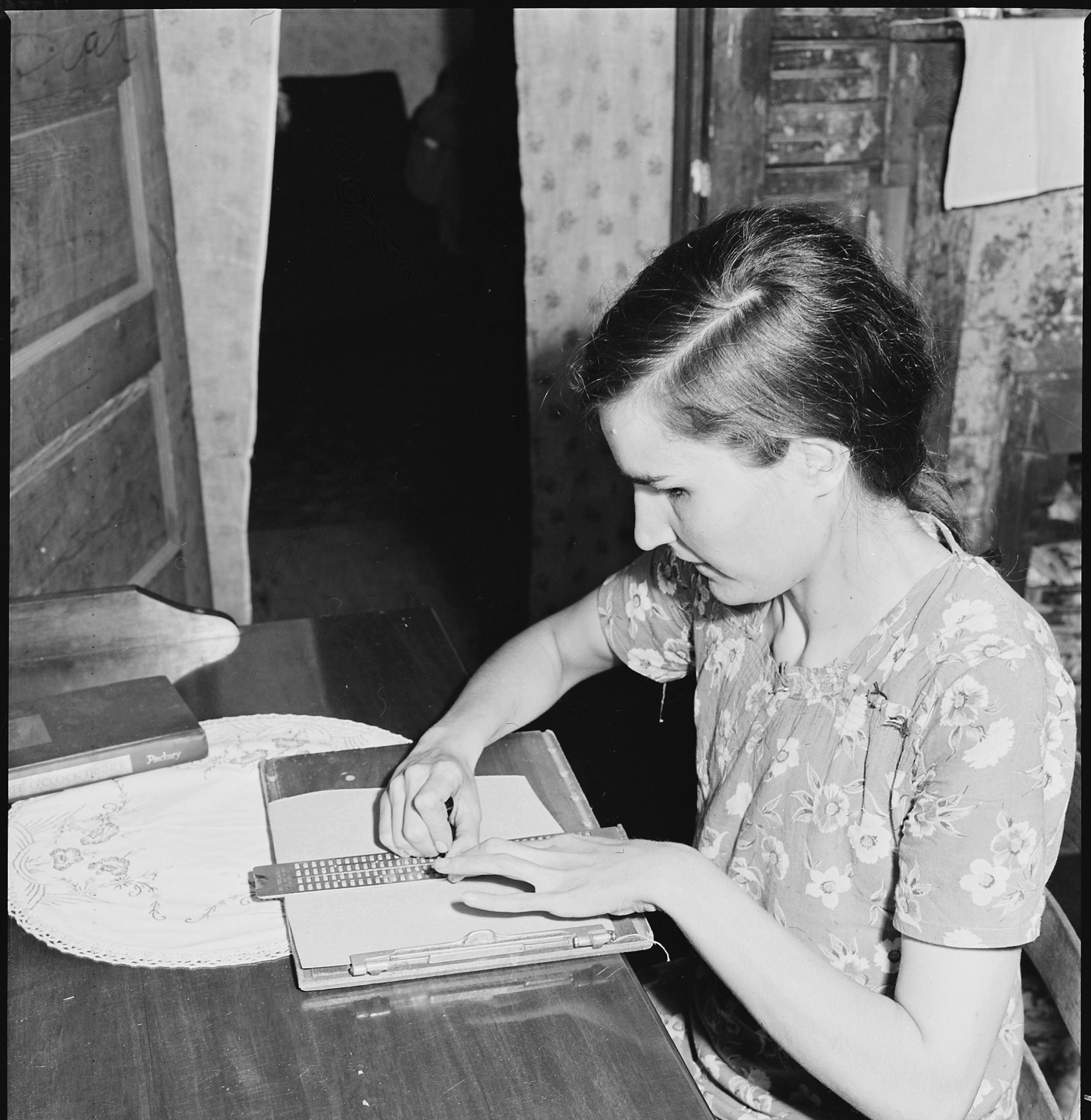 Lucy Sergent’s face, hands, stylus and writing frame in Russell Lee’s 1946 photograph