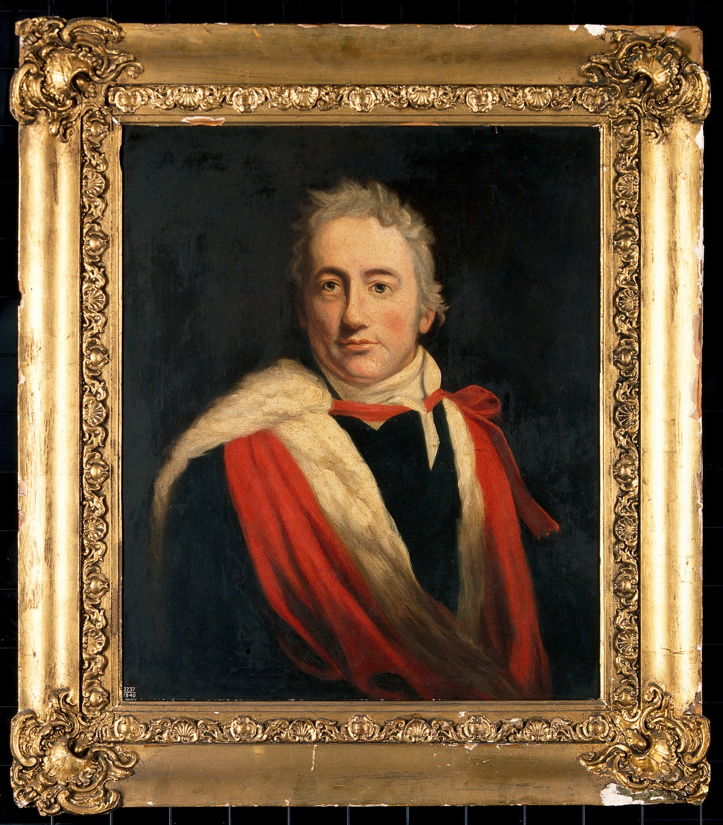 Humphry Davy wearing academic robes in a framed oil portrait