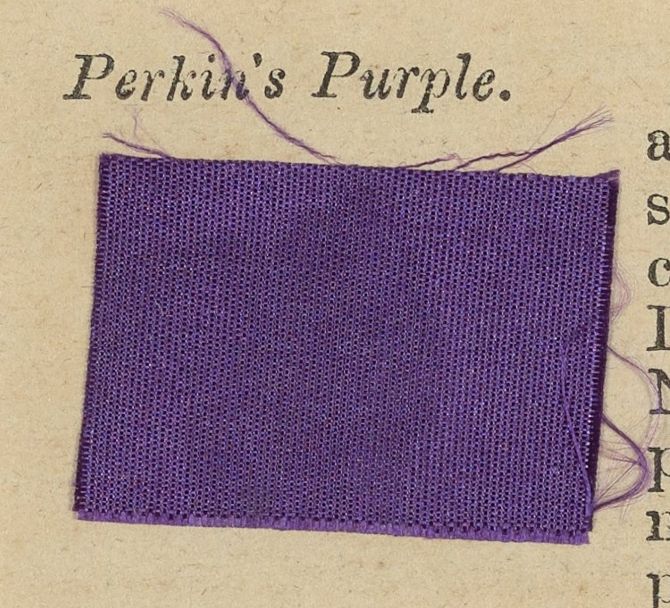 A purple woven fabric specimen with loose threads, attached beneath the printed label Perkin’s Purple