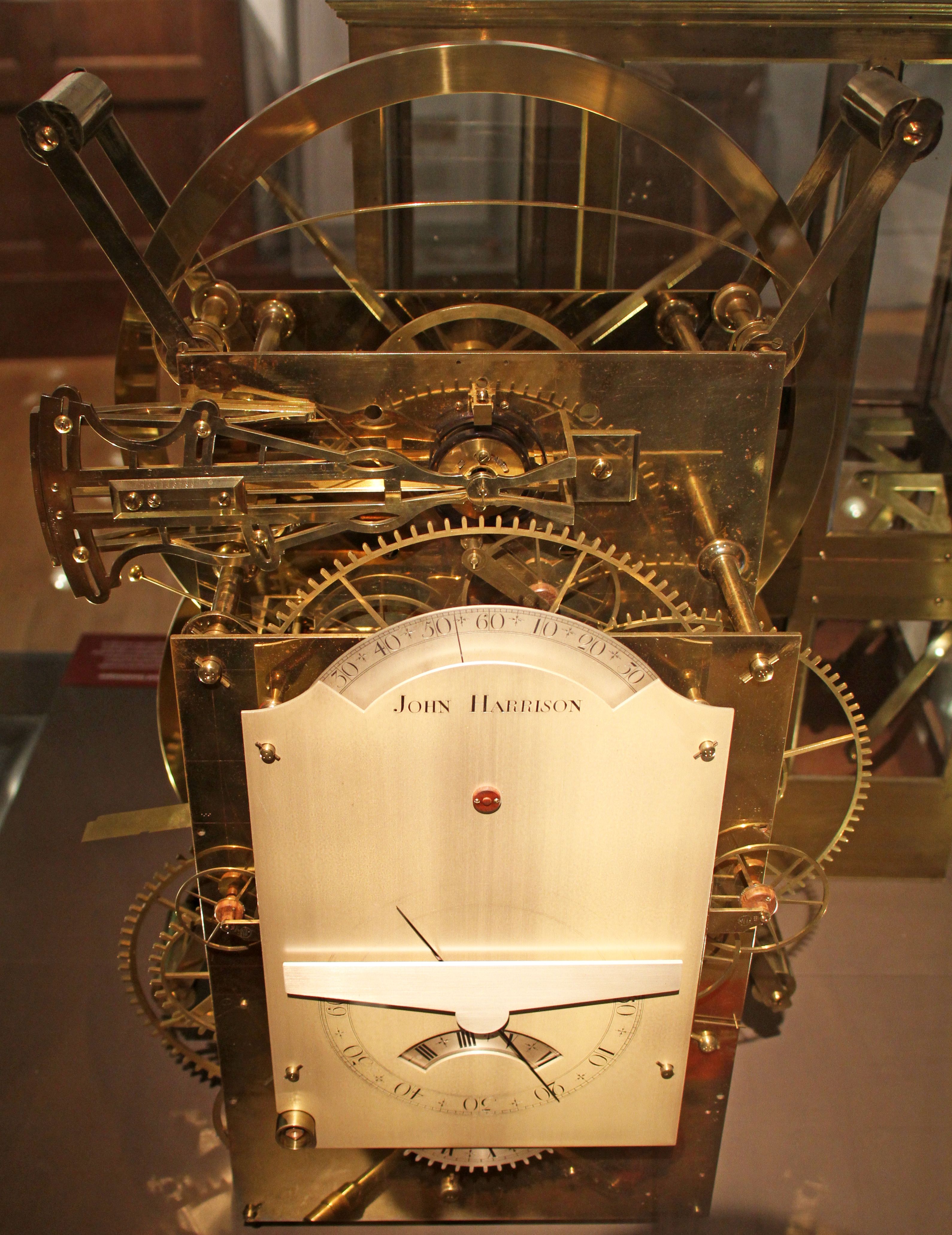 Harrison's H3, with exposed brass wheels and large circular balances above its dial