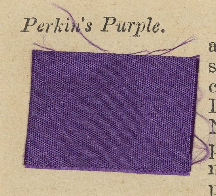 A purple woven fabric specimen with loose threads, attached beneath the printed label Perkin’s Purple