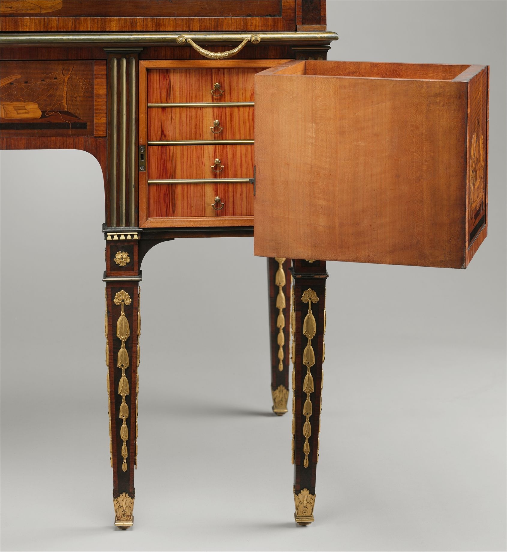 A projecting drawer unit swung sideways from a desk, with a second bank of drawers visible inside.