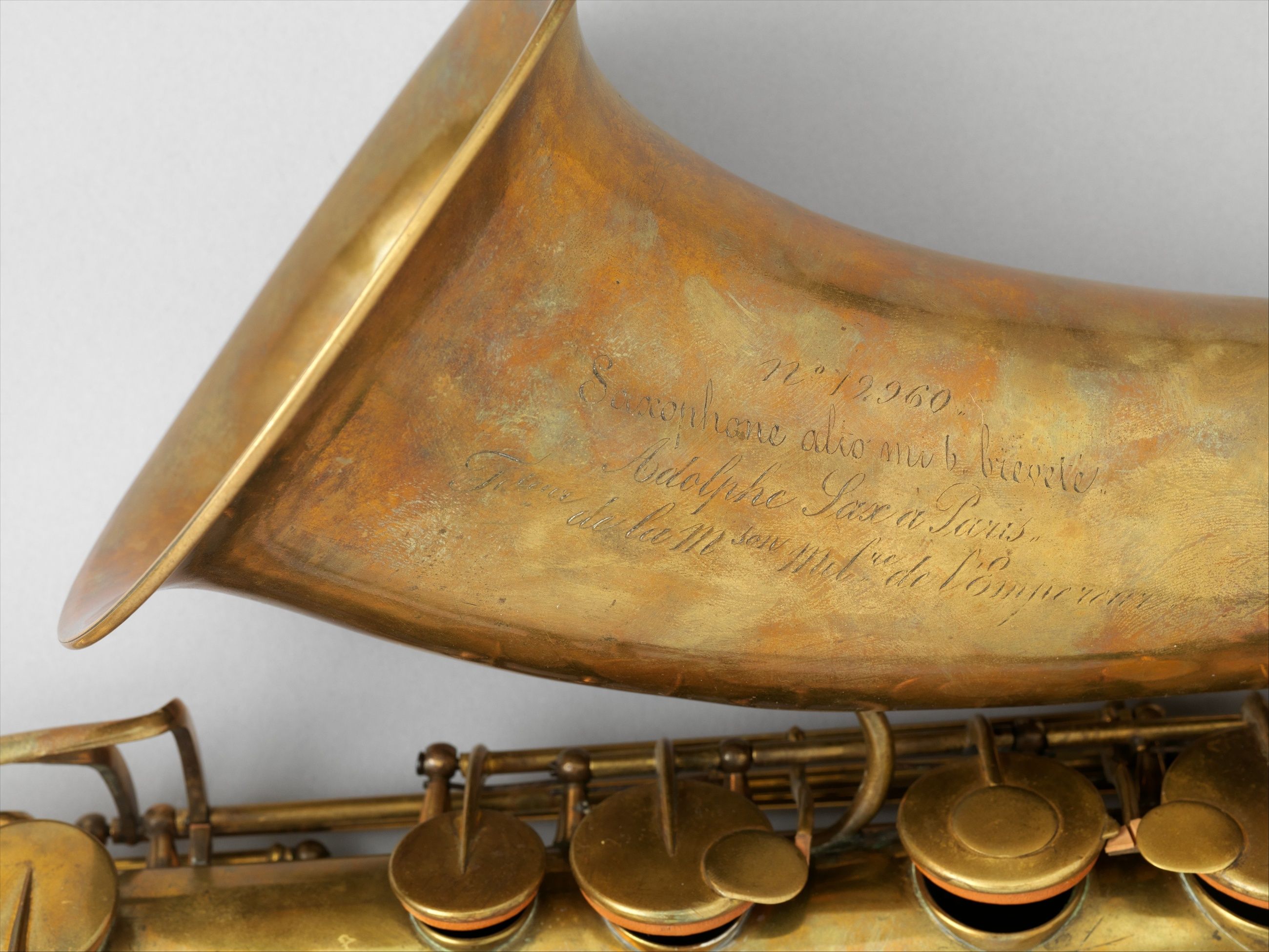 Sax’s name and military appointment engraved on an alto saxophone bell