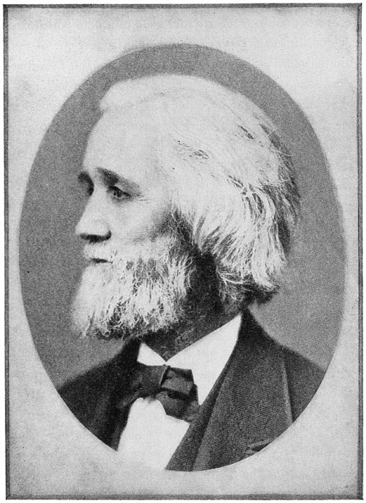 A bearded Christopher Latham Sholes in profile, wearing a dark coat and bow tie