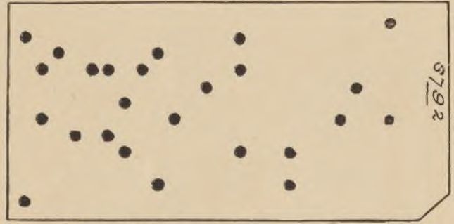 A nearly blank card has scattered round holes, the handwritten number 6792 and a clipped lower right corner.