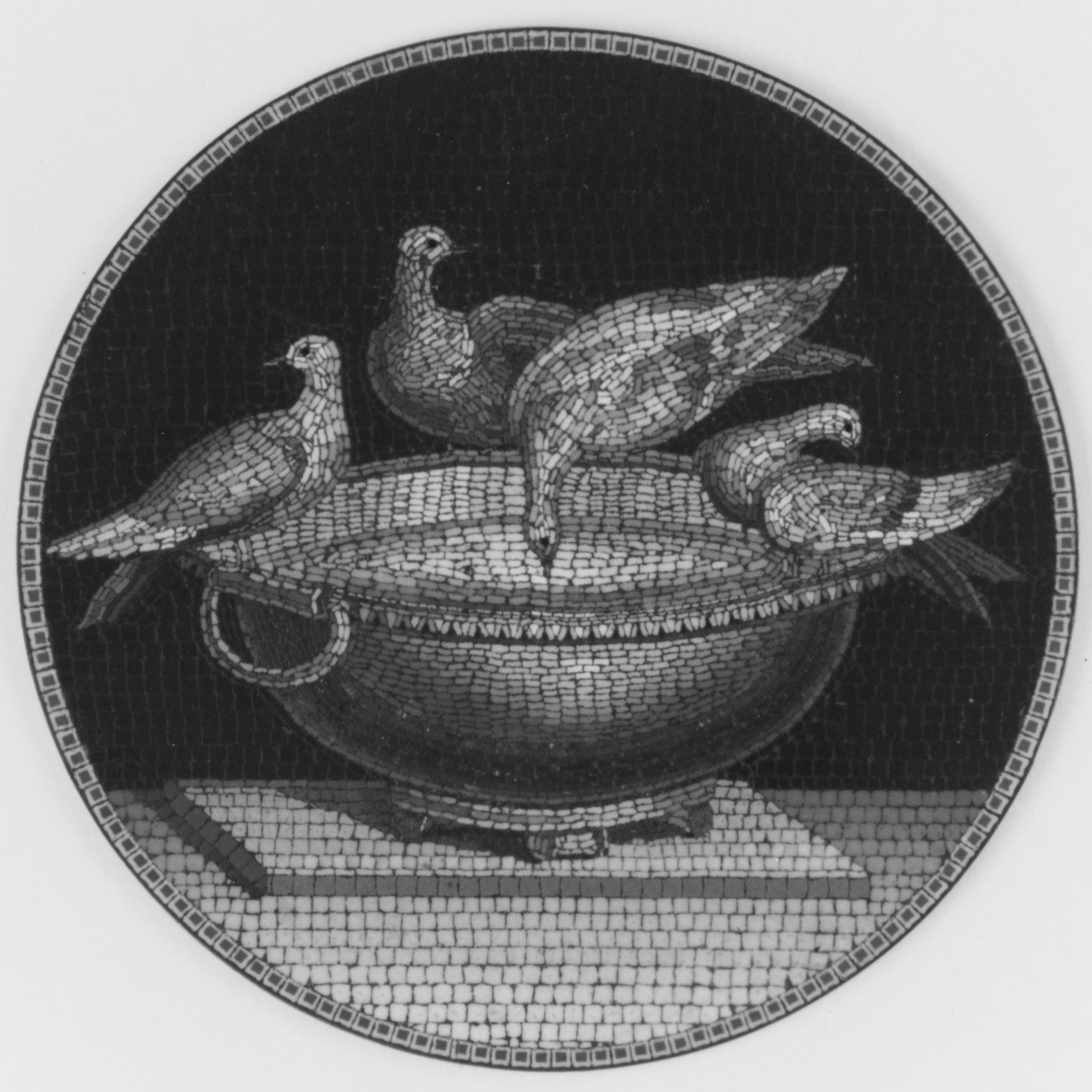 Four doves arranged around a bowl in a circular glass mosaic