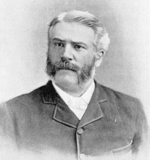 Jesse Lyman Hurlbut in a dark coat, with grey hair, moustache and side whiskers